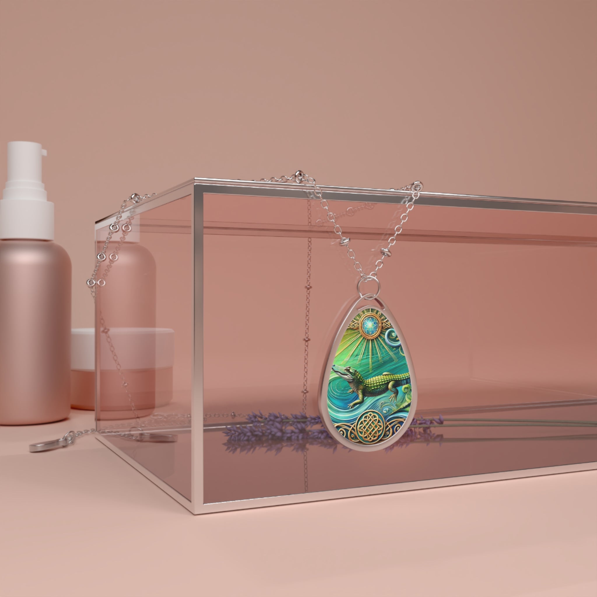 A silver necklace featuring an alligator pendant draped over a clear box with lavender and cosmetics in the background, set against a soft pink backdrop. The pendant depicts a detailed alligator swimming in vibrant turquoise waters with radiant sun and celestial motifs above, symbolizing primal strength and protection.