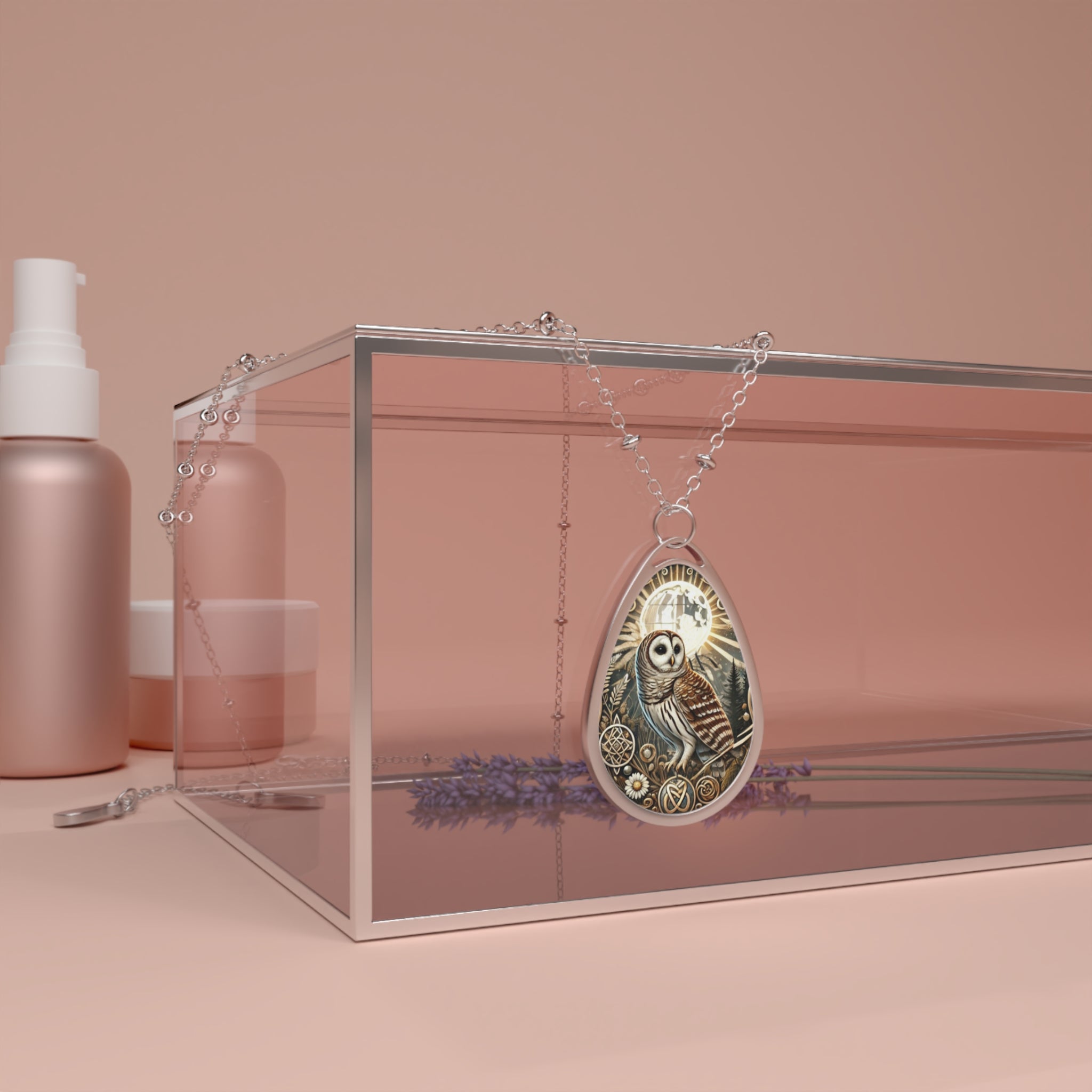 A delicate Barred Owl necklace with intricate detailing, featuring an owl surrounded by mystical symbols. The necklace is draped over a glass display box, with soft, peach-toned cosmetics in the background, creating a serene and elegant aesthetic.