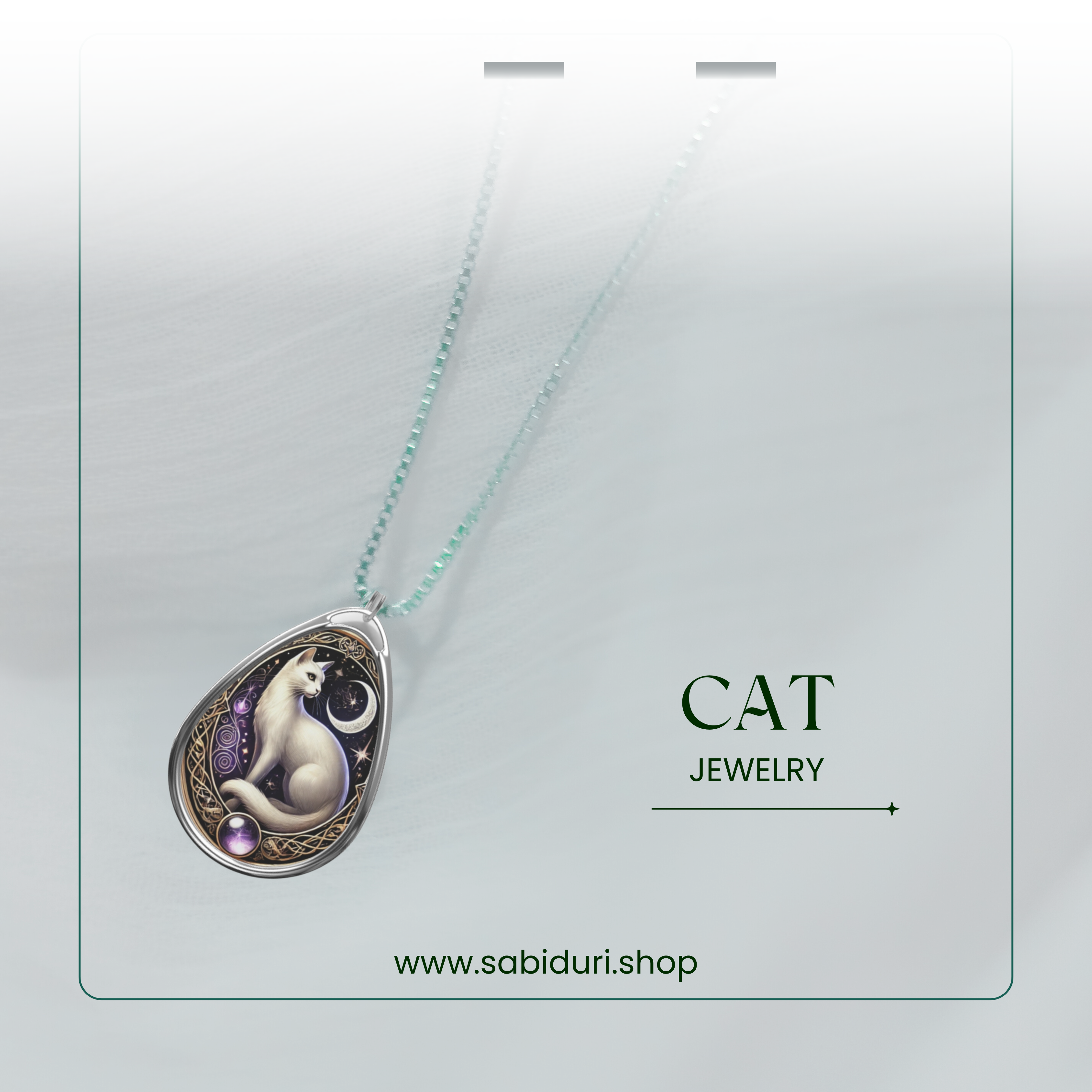 A cat-inspired pendant with a white feline, crescent moon, and intricate golden frame, suspended from a delicate chain. The background is soft and ethereal, with "CAT JEWELRY" and "www.sabiduri.shop" written in refined typography.