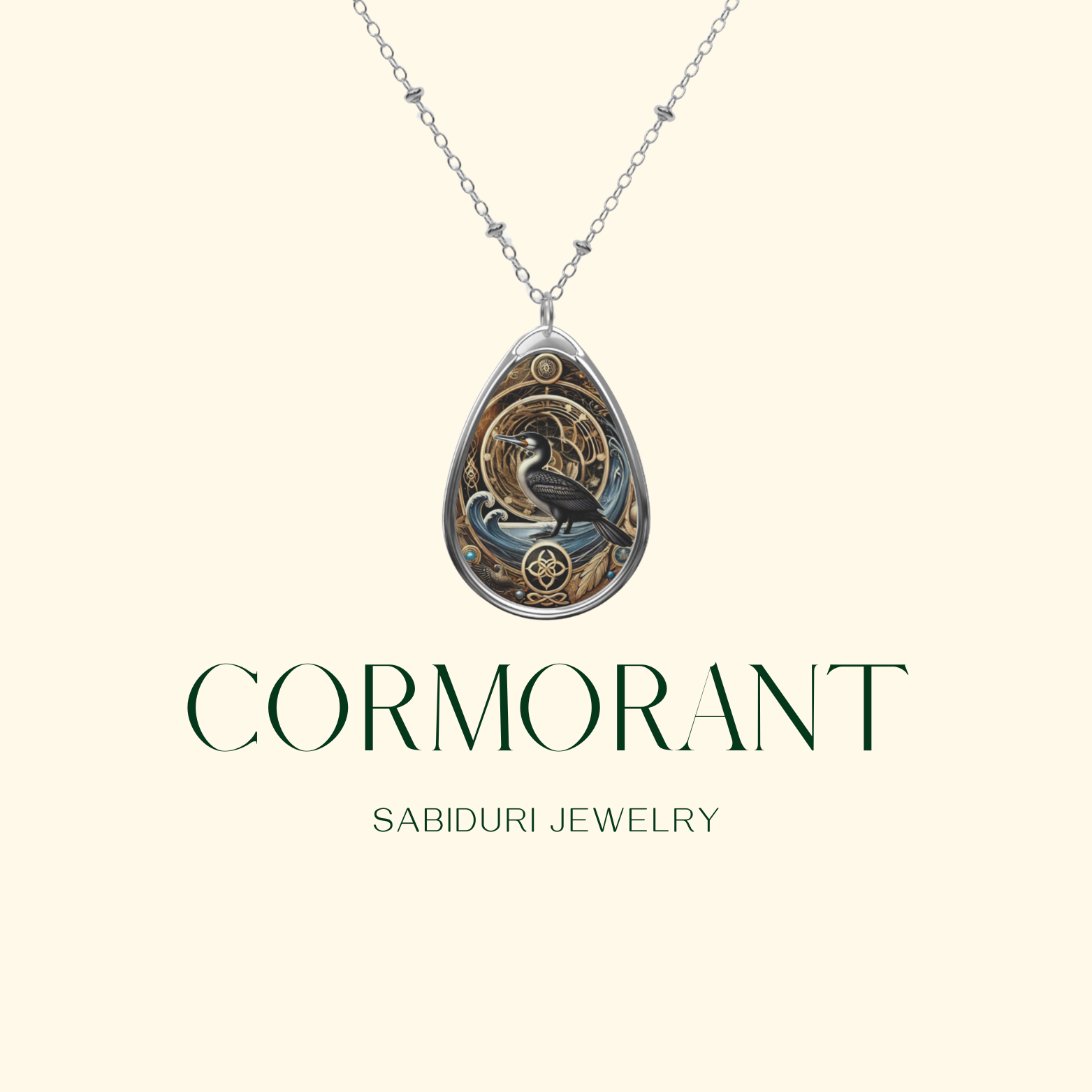 A minimalist presentation of the cormorant necklace against a soft cream background. The pendant, featuring a black cormorant framed by golden swirls and blue accents, hangs from a silver chain. Below it, "CORMORANT" and "SABIDURI JEWELRY" are written in an elegant font.