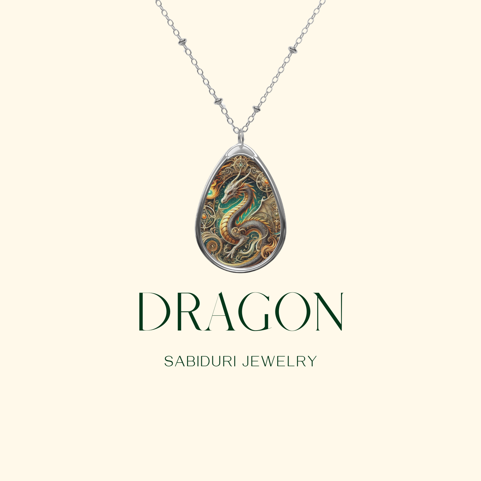 A close-up of a Dragon necklace with an intricate design, featuring a curled golden-green dragon surrounded by ornate detailing. The minimalist cream-colored background includes the words "DRAGON" and "SABIDURI JEWELRY" in a sophisticated font.
