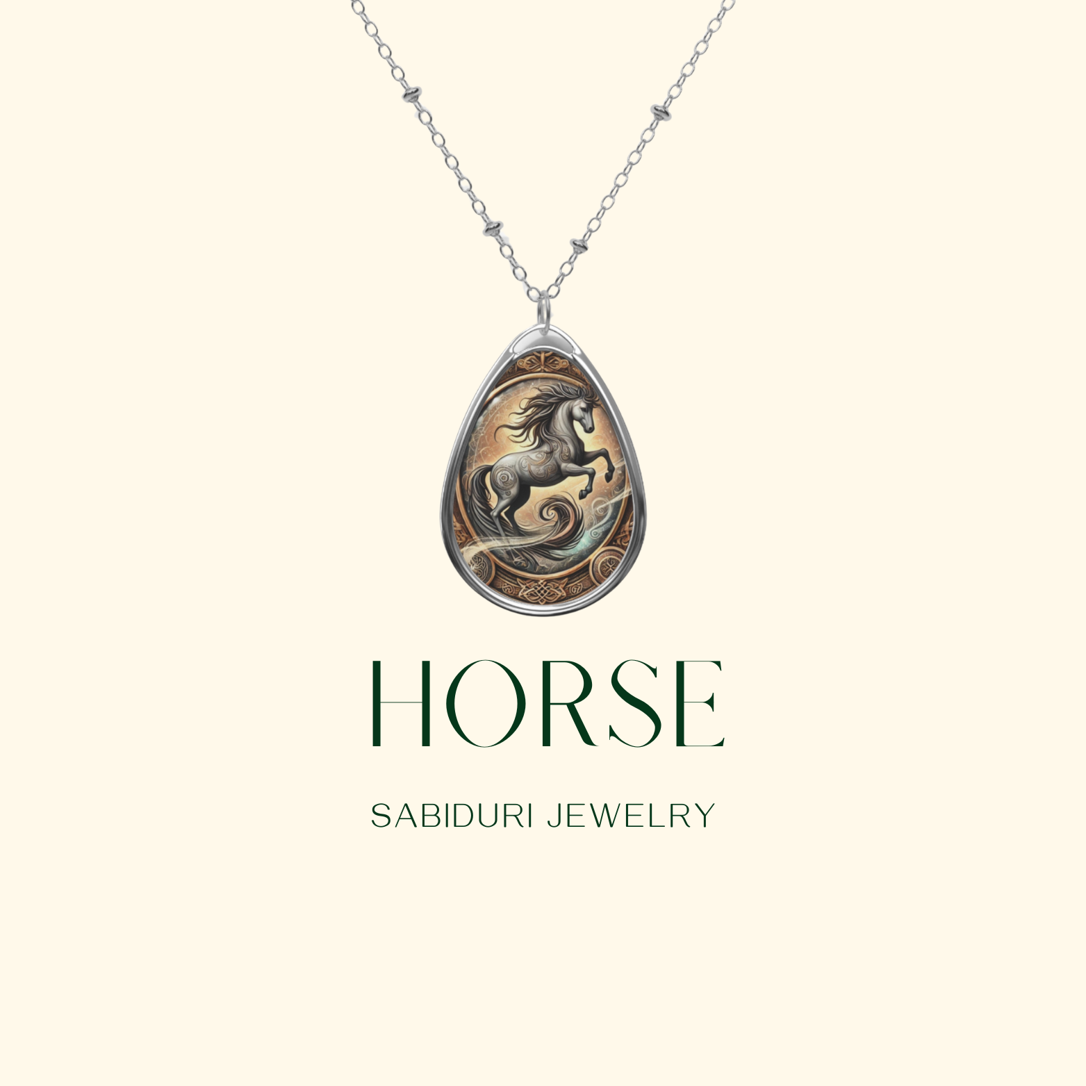 A silver teardrop-shaped pendant featuring an intricately designed horse with flowing mane, surrounded by swirling engravings and earthy tones, hanging from a delicate chain. Text below reads "HORSE - SABIDURI JEWELRY" on a minimalist beige background.