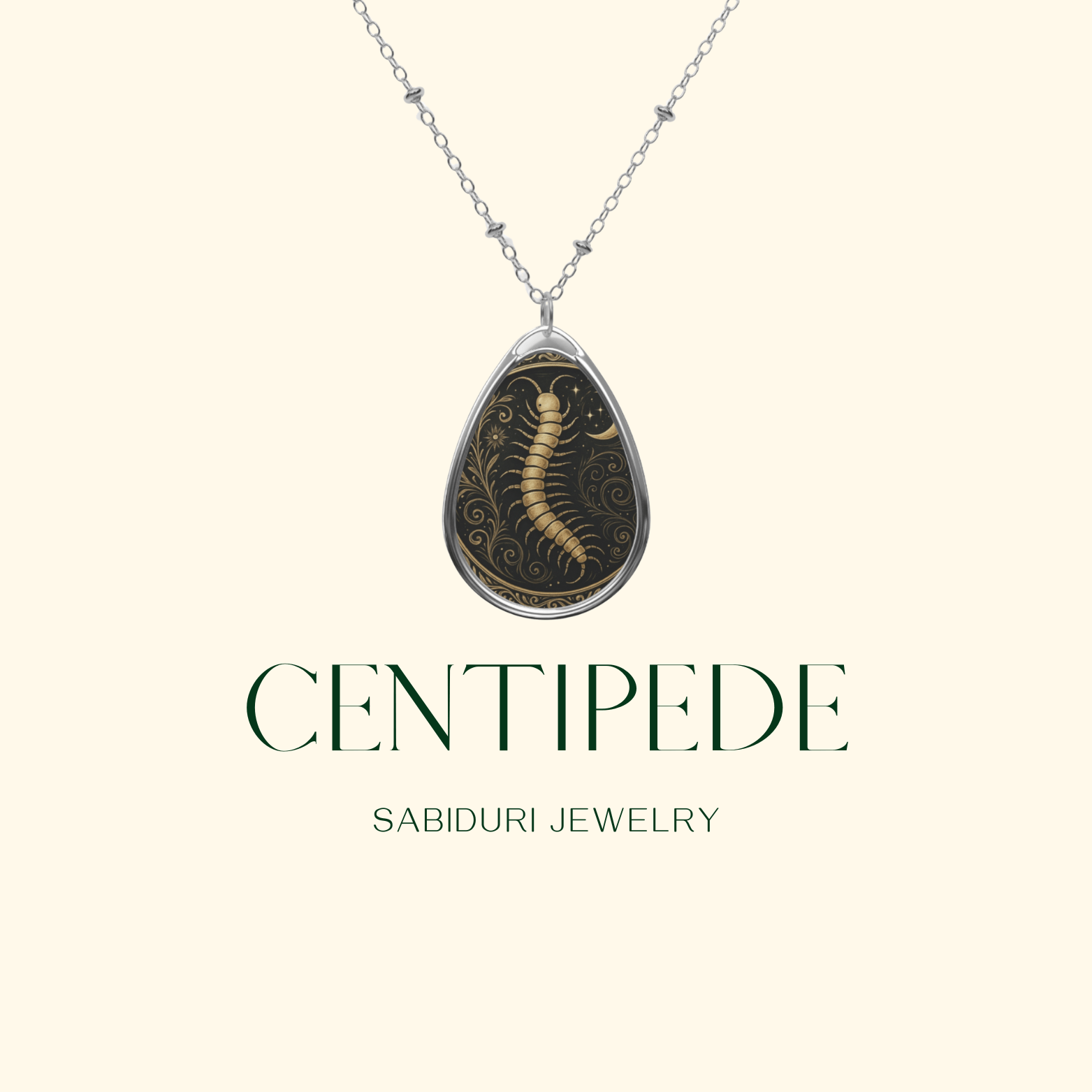 Close-up of the Centipede Spirit Animal Necklace with intricate gold details on a black background, labeled "CENTIPEDE – SABIDURI JEWELRY."
