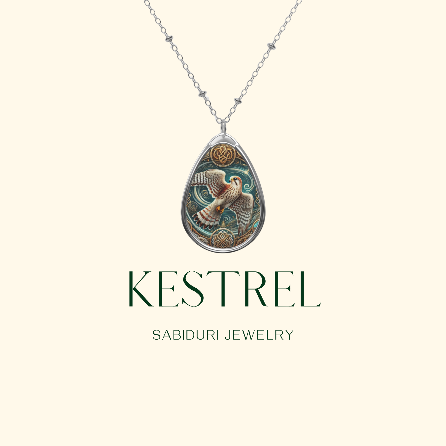 A detailed kestrel necklace with a vintage-inspired silver pendant, showcasing a majestic kestrel soaring against a celestial backdrop. The pendant hangs on a delicate chain against a soft cream background with "KESTREL" and "SABIDURI JEWELRY" in elegant typography.