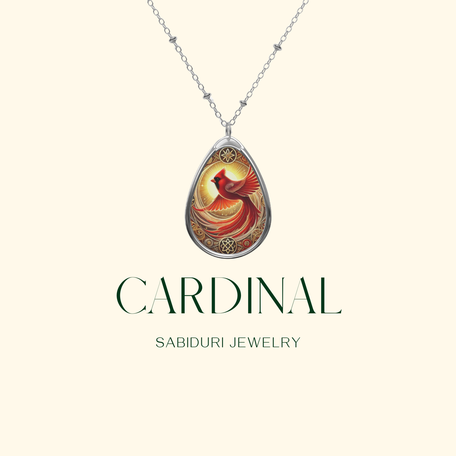 A sleek product display of a cardinal spirit animal necklace, suspended on a delicate silver chain. The teardrop-shaped pendant features an ornate design of a red cardinal against a golden background, framed with intricate gold detailing, with "CARDINAL" and "SABIDURI JEWELRY" printed beneath.