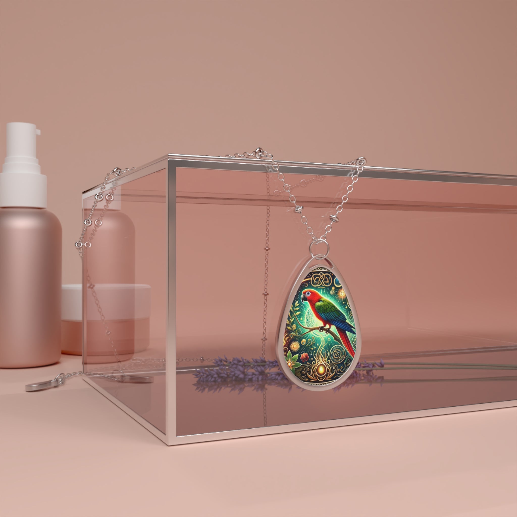 The parrot necklace draped over a transparent glass box, surrounded by lavender sprigs and soft pink-toned cosmetics containers. The pendant's rich colors and filigree details stand out against the muted background.