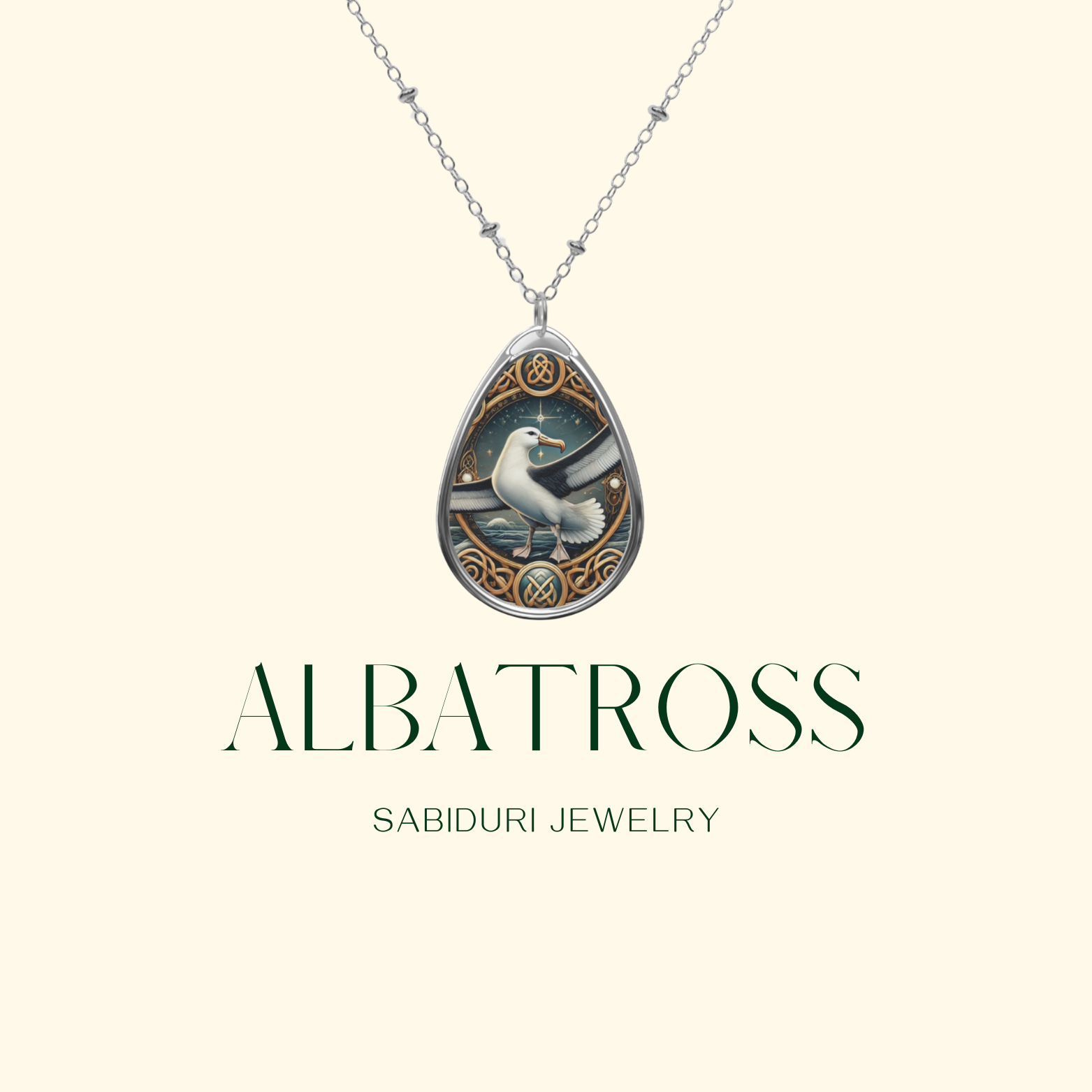 A delicate silver necklace with a teardrop-shaped pendant showcasing an albatross gliding through the sky, surrounded by elegant nautical-inspired details. The pendant is displayed on a neutral background, with the text "ALBATROSS" and "SABIDURI JEWELRY" elegantly positioned beneath.