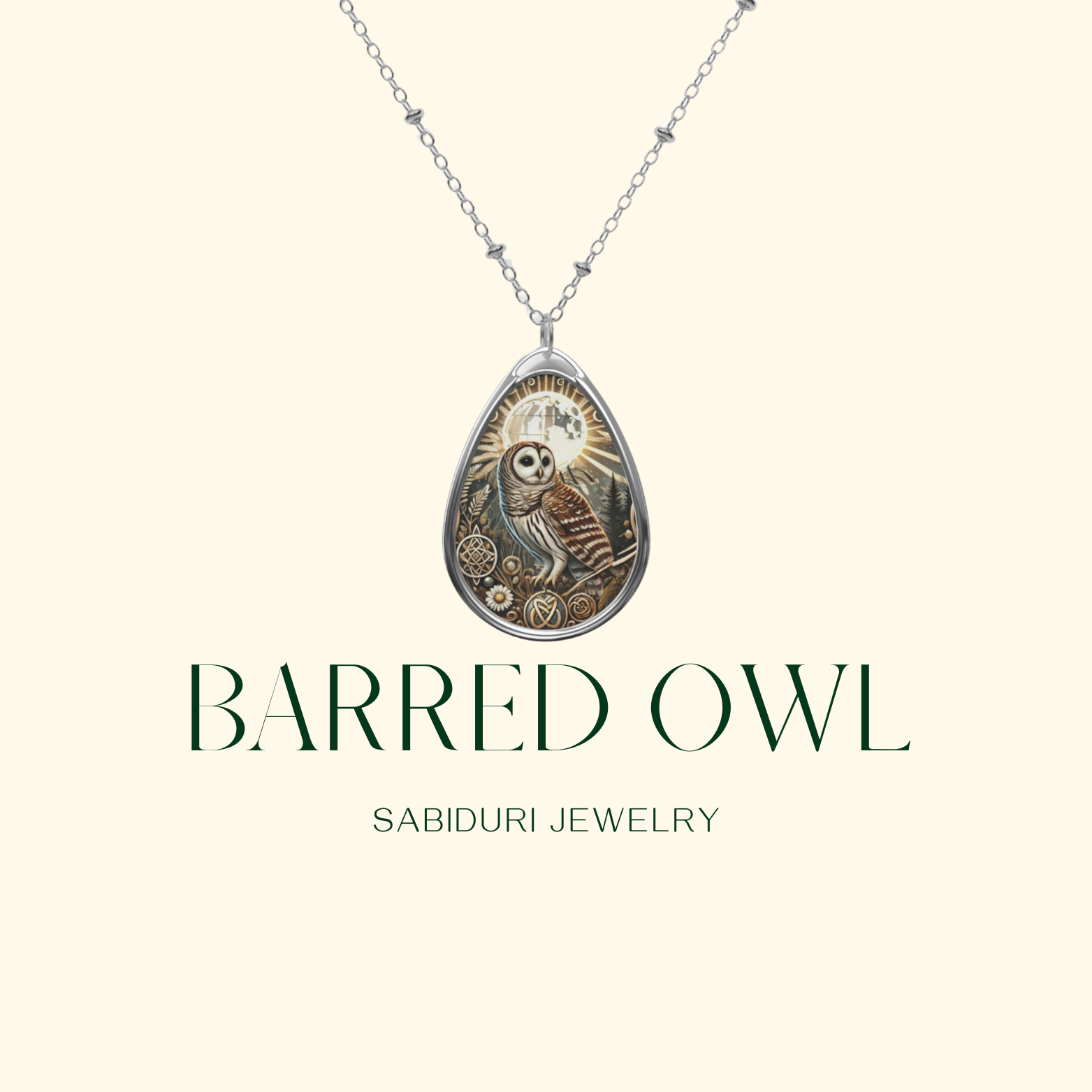 A minimalistic display of a Barred Owl necklace with a teardrop-shaped pendant, featuring a detailed owl illustration. The background is a soft beige, with the text "BARRED OWL" and "SABIDURI JEWELRY" in elegant green font.