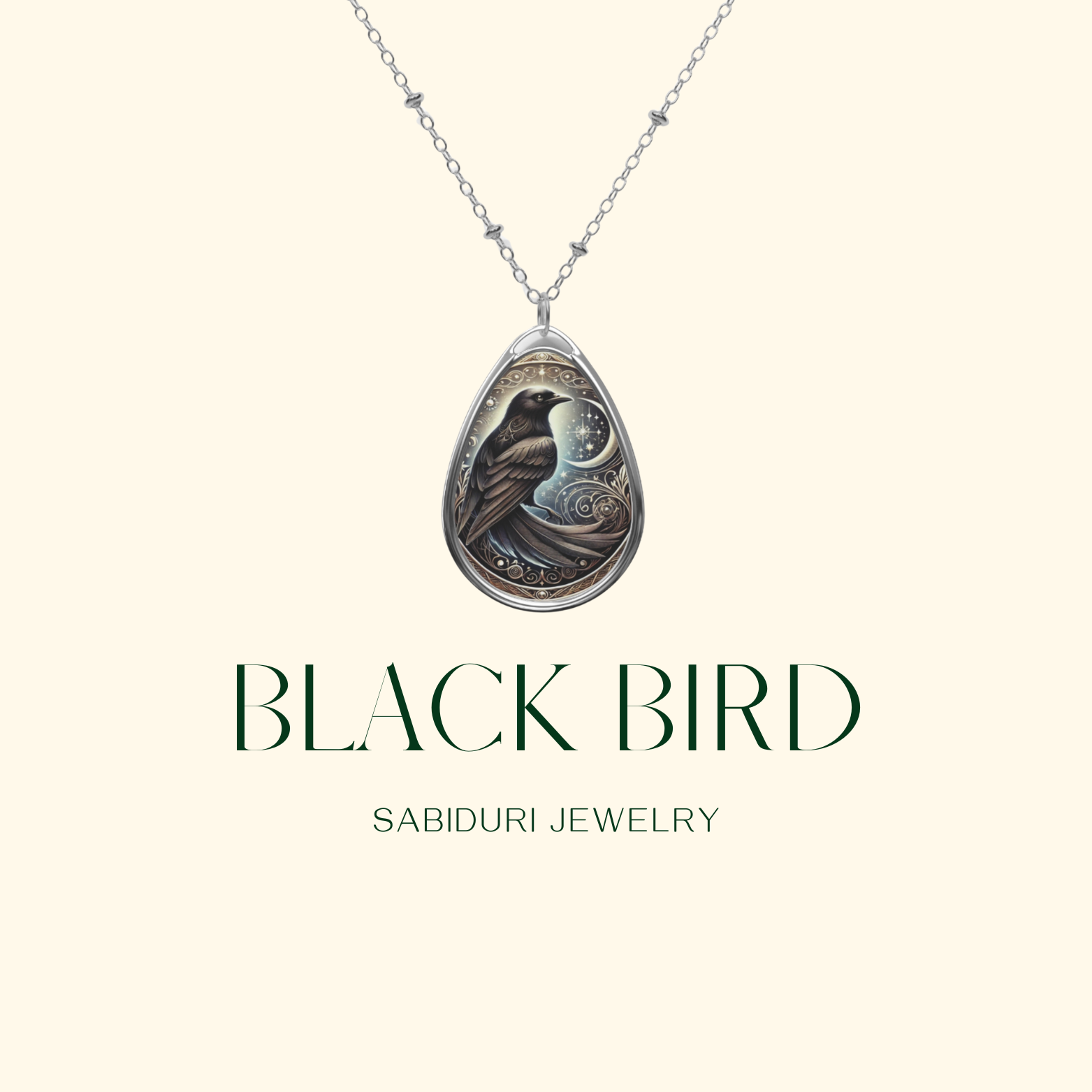 A minimalist product image of the Black Bird Spirit Animal Necklace on a soft cream background, featuring the pendant suspended from a silver chain with "Black Bird" and "Sabiduri Jewelry" written below.