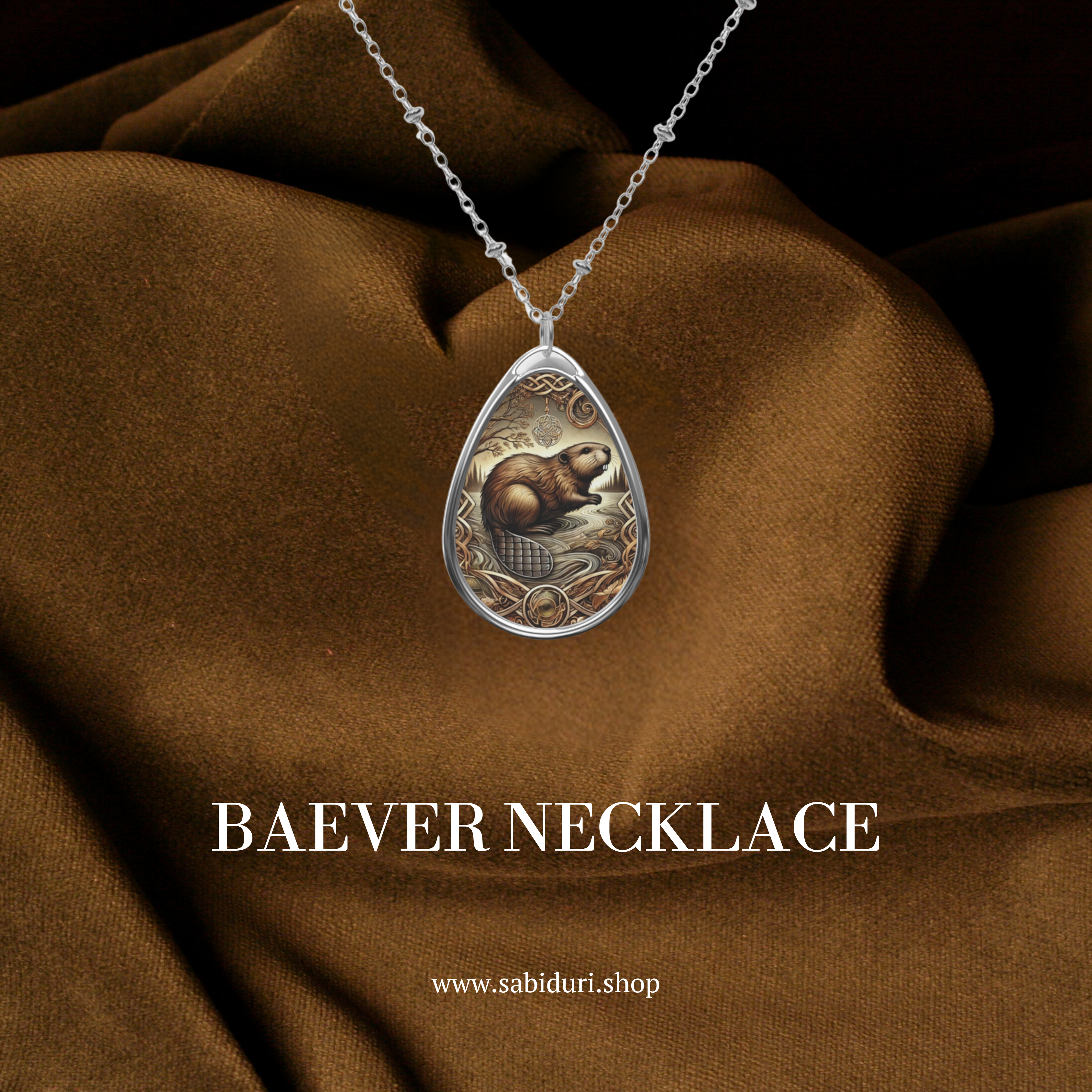 A close-up of the bobcat necklace against a luxurious brown fabric backdrop. The pendant showcases a detailed bobcat standing in a natural setting, framed with ornate golden accents. Below, the text "BOBCAT NECKLACE" and "www.sabiduri.shop" add branding.

