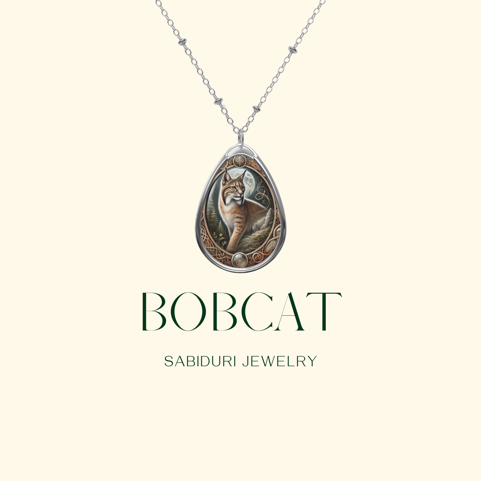 A product-focused image featuring the bobcat necklace with a minimalist cream-colored background. The pendant, suspended on a silver chain, has "BOBCAT" and "SABIDURI JEWELRY" written in elegant green typography.