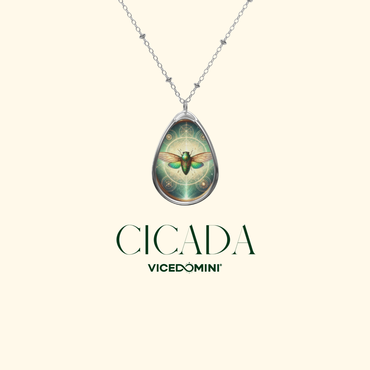 A clean product display of the cicada pendant necklace against a cream background, with text "Cicada - VICEDOMINI" in elegant green font.