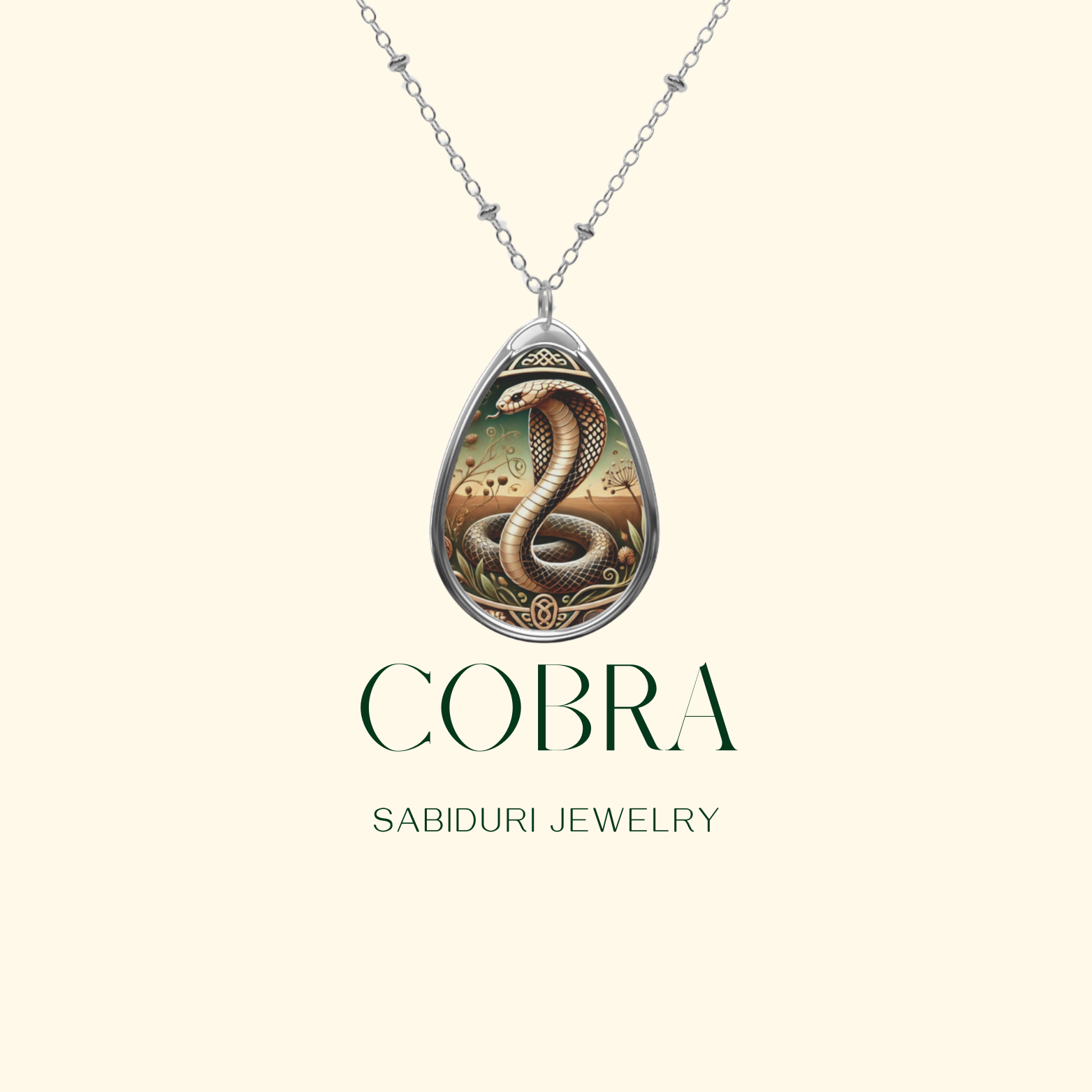 A close-up of a cobra pendant necklace on a cream-colored background, showcasing a striking cobra surrounded by intricate patterns and natural elements. The text reads "COBRA Sabiduri Jewelry.