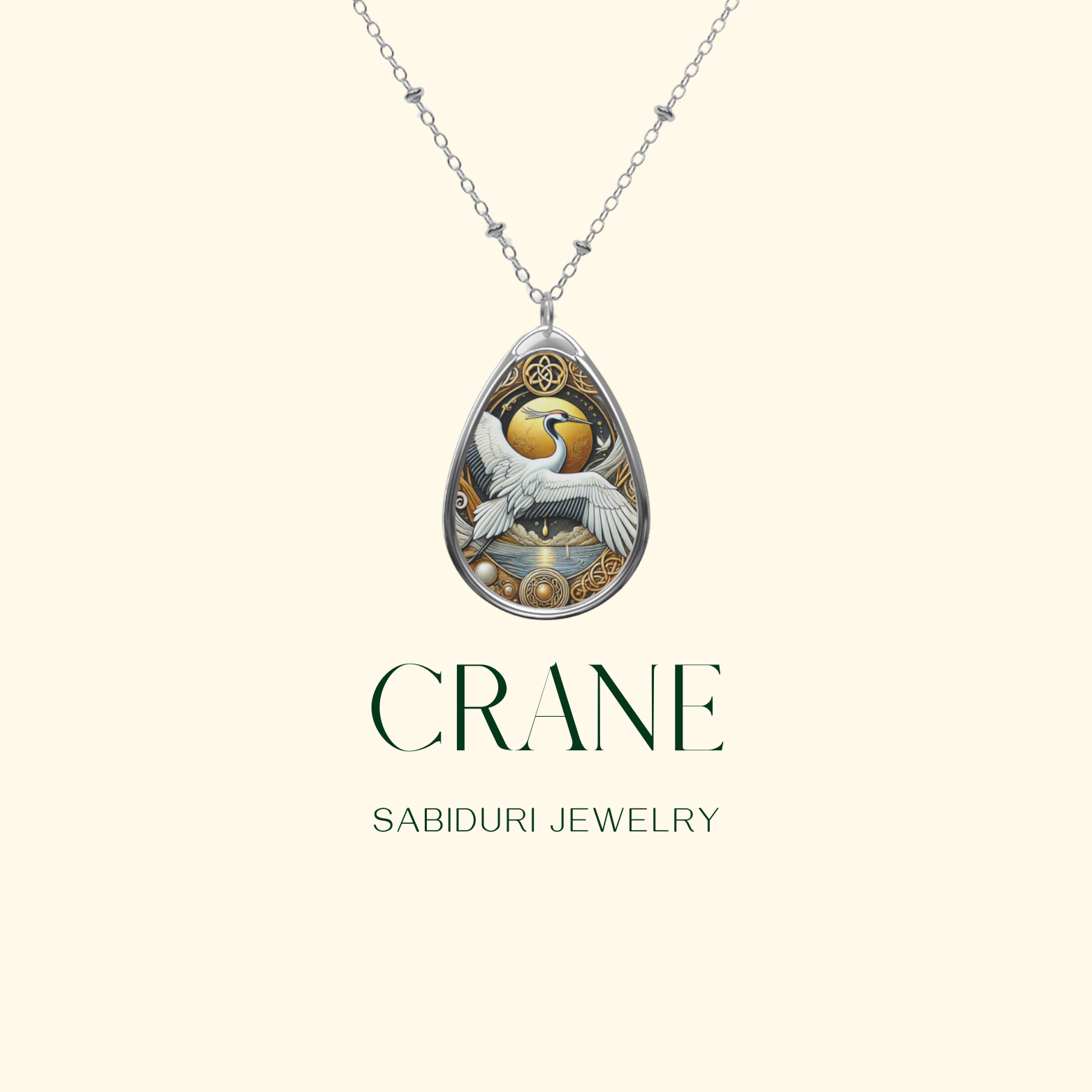 A detailed product shot of the Crane Necklace displayed on a light beige background. The pendant's intricate design of a white crane in motion with a golden sun and celestial accents is prominently featured. The words "CRANE" and "SABIDURI JEWELRY" are elegantly written beneath.