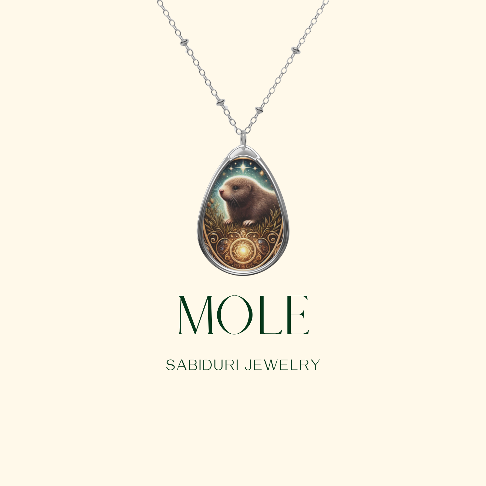 A teardrop-shaped silver pendant featuring an intricately detailed mole sitting in a field of golden grass under a starry night sky. The pendant has ornate golden swirls and a glowing circular gemstone at the base. Below, the words "MOLE" and "SABIDURI JEWELRY" are elegantly displayed.