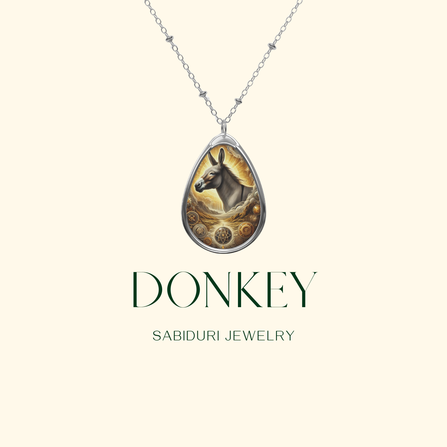 A centered, clean presentation of the donkey pendant necklace on a soft cream background. The text "DONKEY - SABIDURI JEWELRY" is displayed below, reinforcing the brand identity.