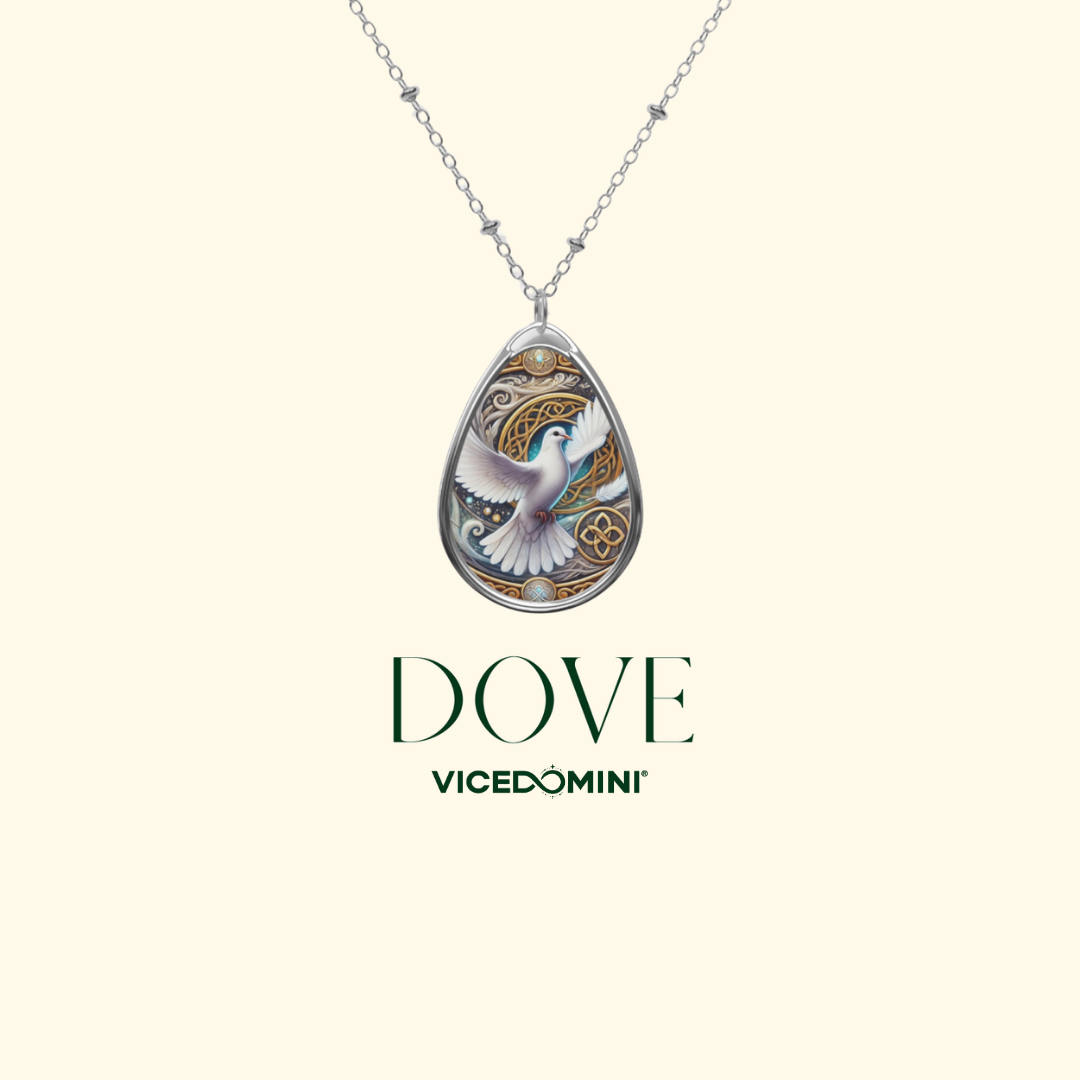 A silver-tone teardrop pendant necklace featuring an enamel dove design with gold, white, and blue details, shown on a light cream background with the brand name 'VOCE' and 'VICEDOMINI' printed below.