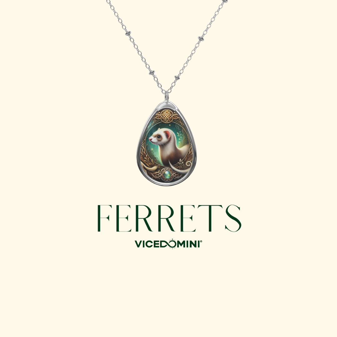 A teardrop-shaped pendant necklace featuring an illustrated ferret in a decorative silver frame, suspended from a delicate silver chain against a light cream background. Below the necklace, the text 'FERRETS' and 'VICEDOMINI' are printed in dark green.