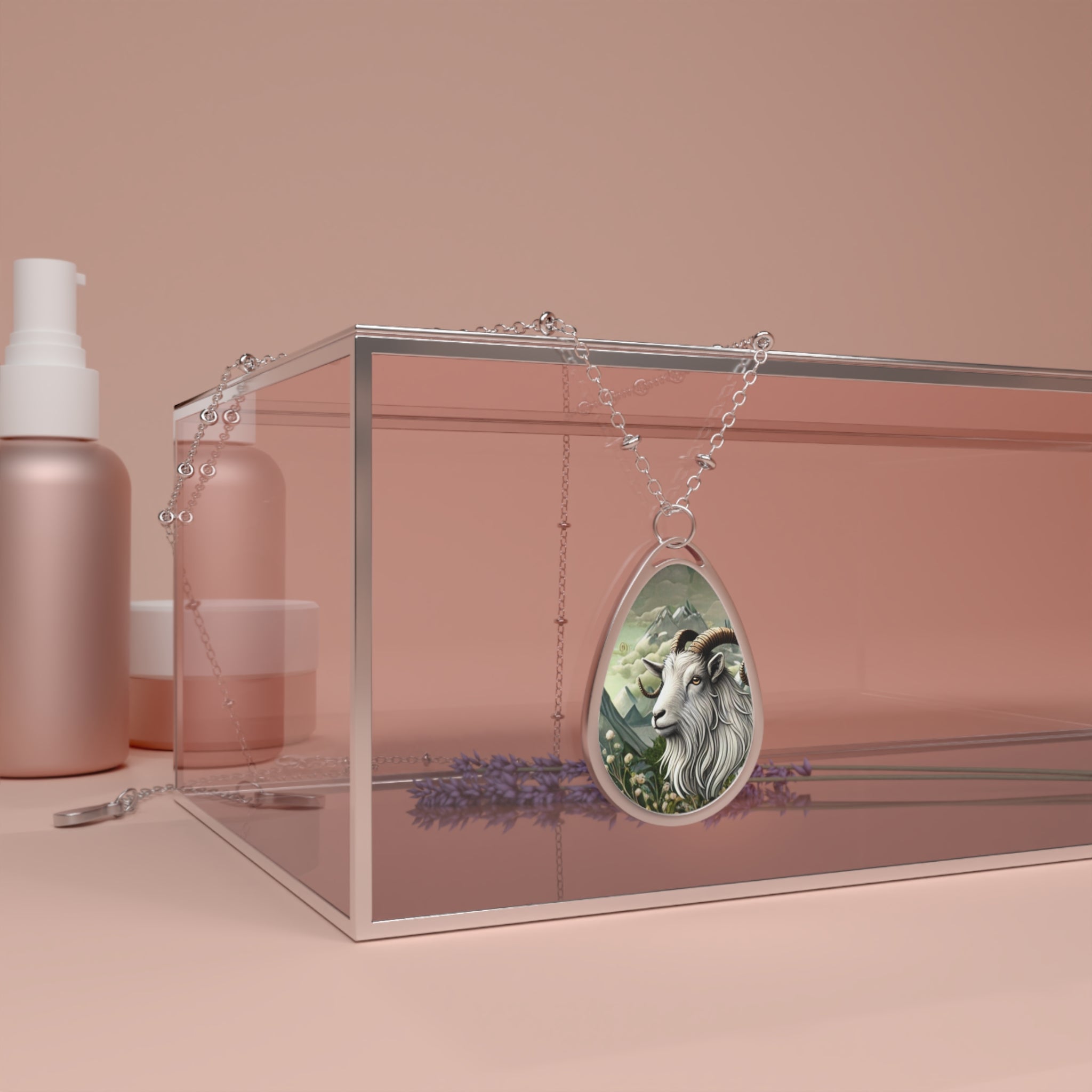 A silver necklace featuring a pendant with a detailed illustration of a goat spirit animal, symbolizing strength and independence, displayed on a glass box alongside cosmetic bottles and lavender flowers in a soft, minimalist setting.