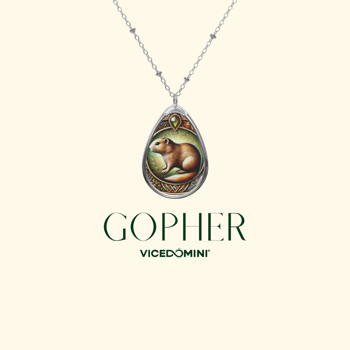 A silver teardrop pendant necklace featuring an illustration of a brown gopher, displayed on a light cream background with the brand name 'GOPHER VICEDOMINI' printed below.