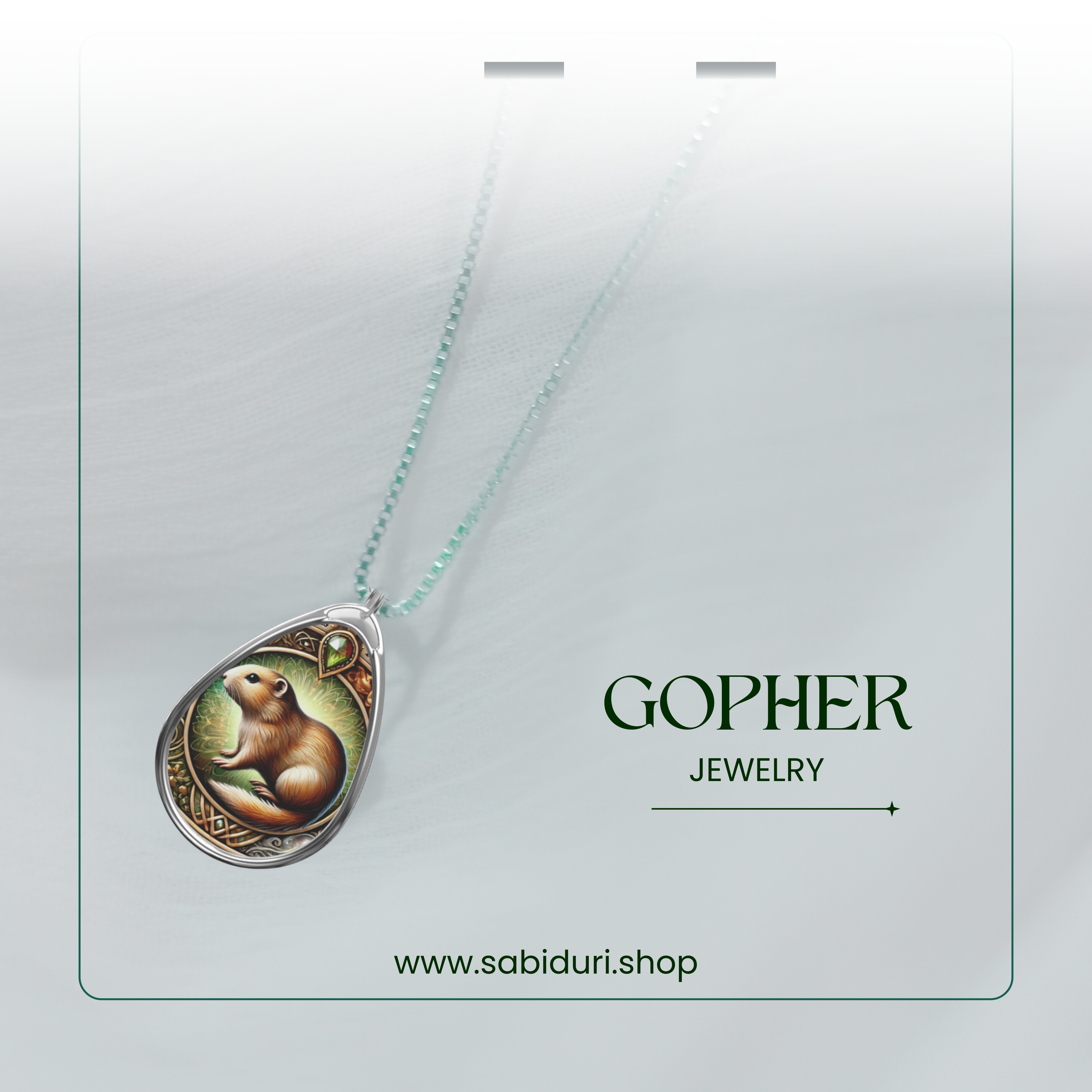 A silver pendant featuring a beautifully crafted gopher, hanging from a delicate chain against a soft, blurred background. The text "Gopher Jewelry" and "www.sabiduri.shop" is displayed in an elegant, modern style.