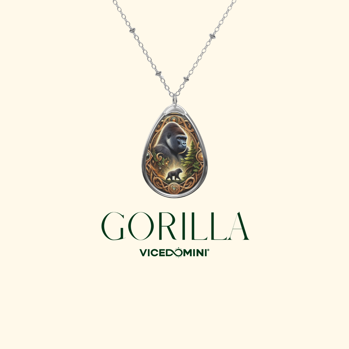 A teardrop-shaped pendant necklace featuring an illustrated gorilla design with gold, green, and black details, suspended from a silver-toned chain. The pendant is centered on a light cream background with the brand name 'GORILLA' and 'VICEDOMINI' printed below.
