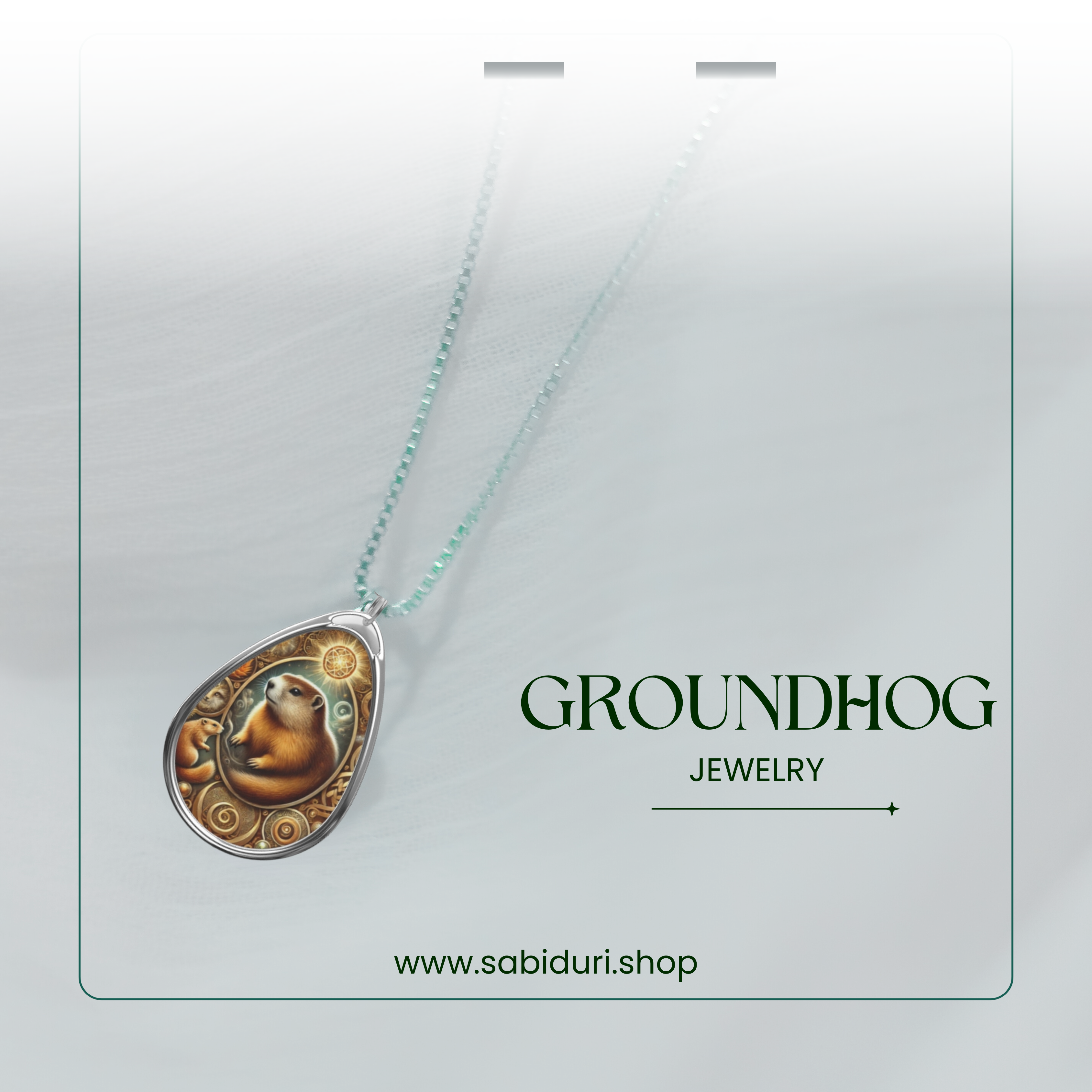 A stylish presentation of the Groundhog pendant with a mystical-inspired design, suspended against a soft, gradient white and green background. The chain appears to fade into the light, emphasizing the intricate craftsmanship of the pendant. The text "GROUNDHOG JEWELRY" and "www.sabiduri.shop" is positioned below in an elegant typeface.