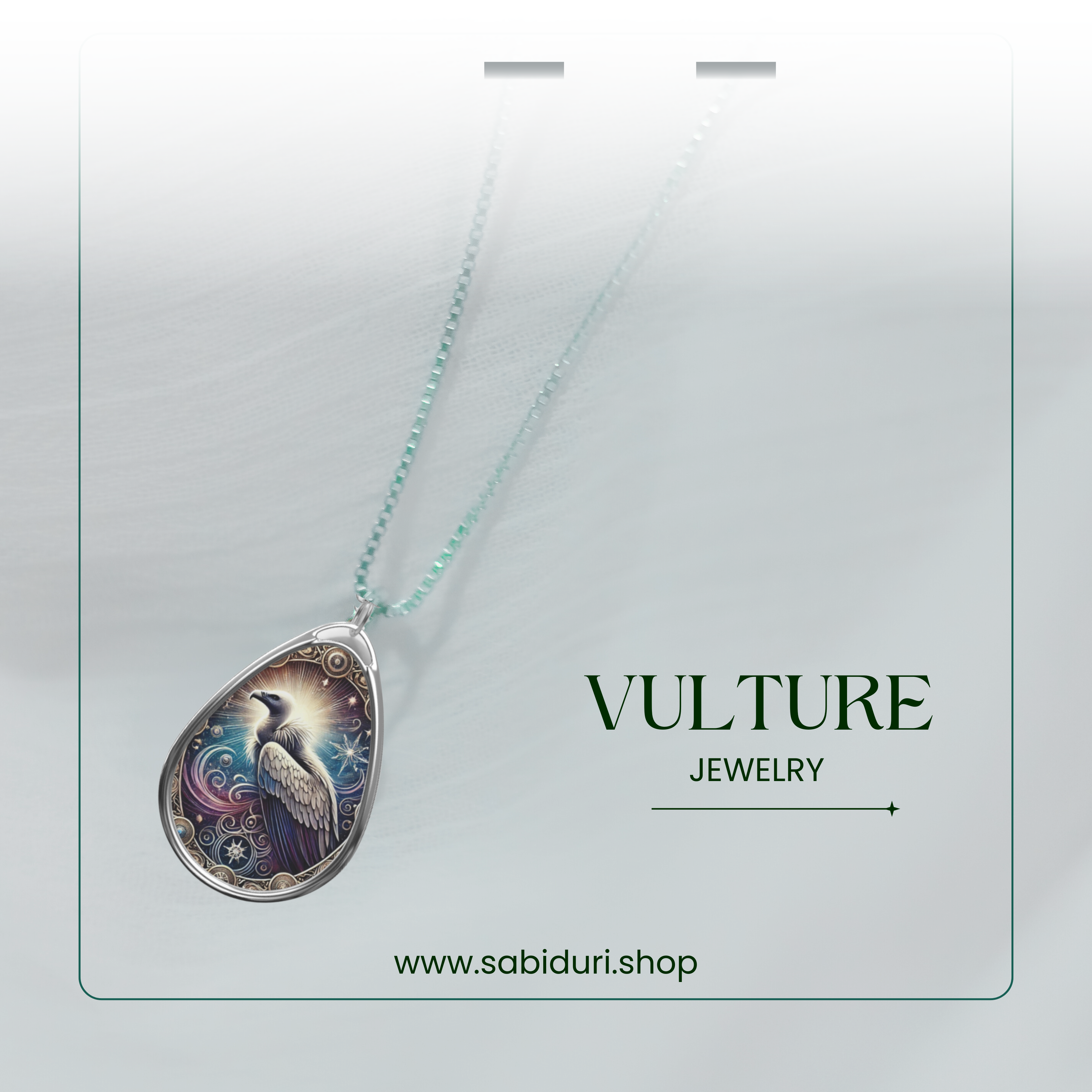 A refined vulture pendant necklace with a celestial-themed design, resting against a soft white fabric. A gradient frame and text reading "VULTURE JEWELRY" and "www.sabiduri.shop" complete the composition.