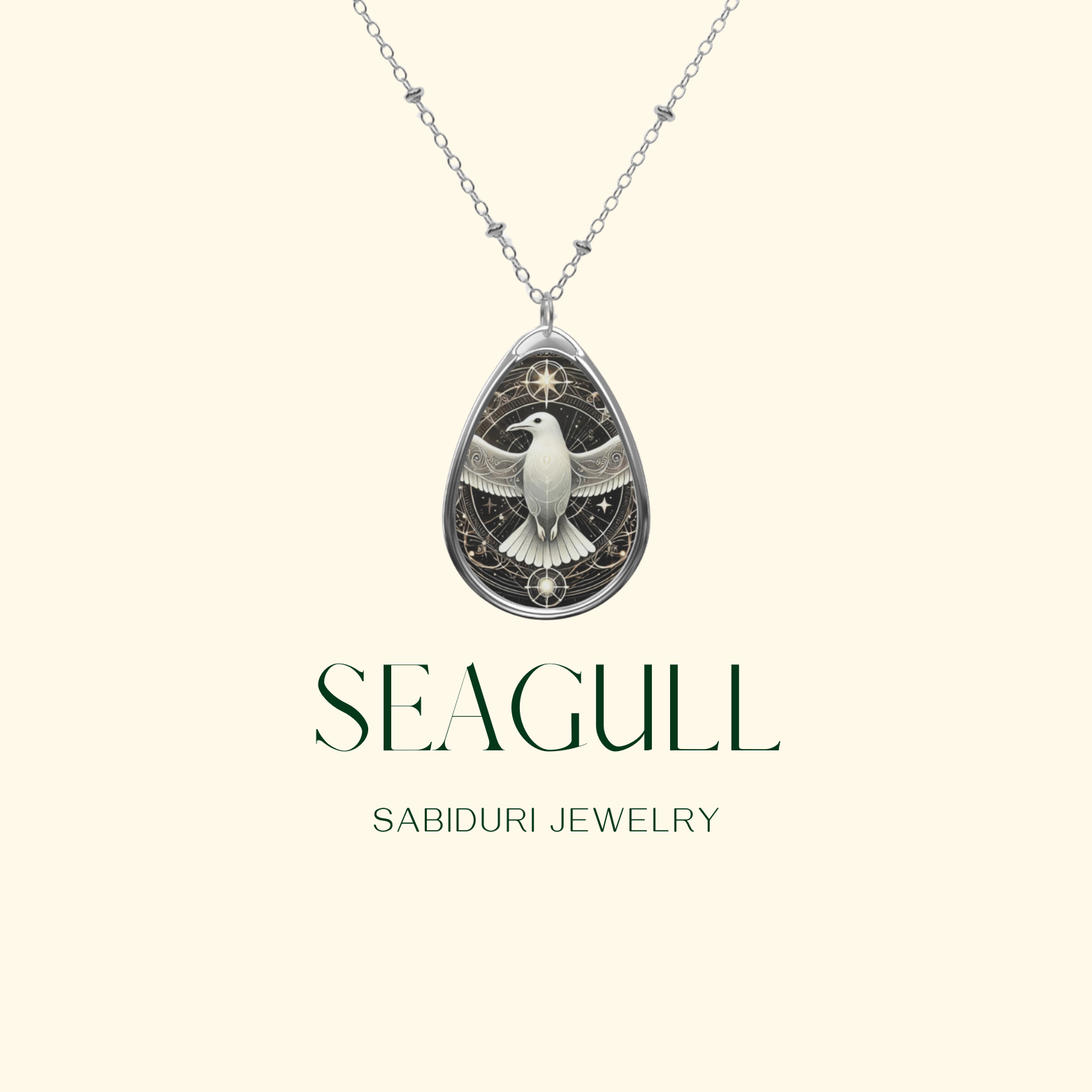 A close-up of the Seagull Necklace against a light beige background. The pendant showcases a detailed seagull with outstretched wings, enclosed in an ornate, celestial-inspired border. The words "SEAGULL" and "SABIDURI JEWELRY" are written in a refined font.