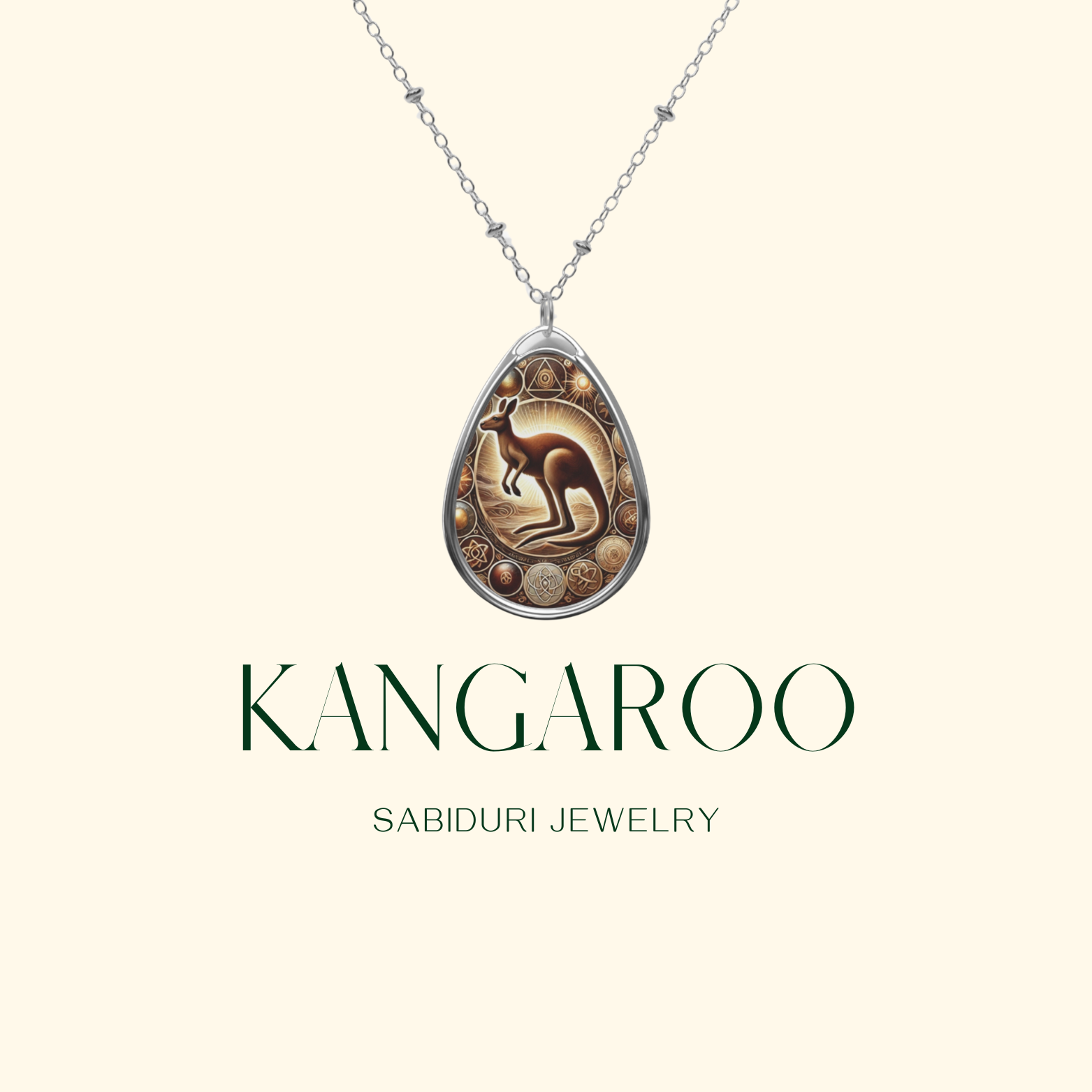 A kangaroo-themed pendant necklace with a beautifully engraved design of a kangaroo surrounded by golden celestial symbols. The pendant hangs from a delicate silver chain, set against a soft cream-colored background, with the words "Kangaroo" and "Sabiduri Jewelry" displayed in elegant typography.