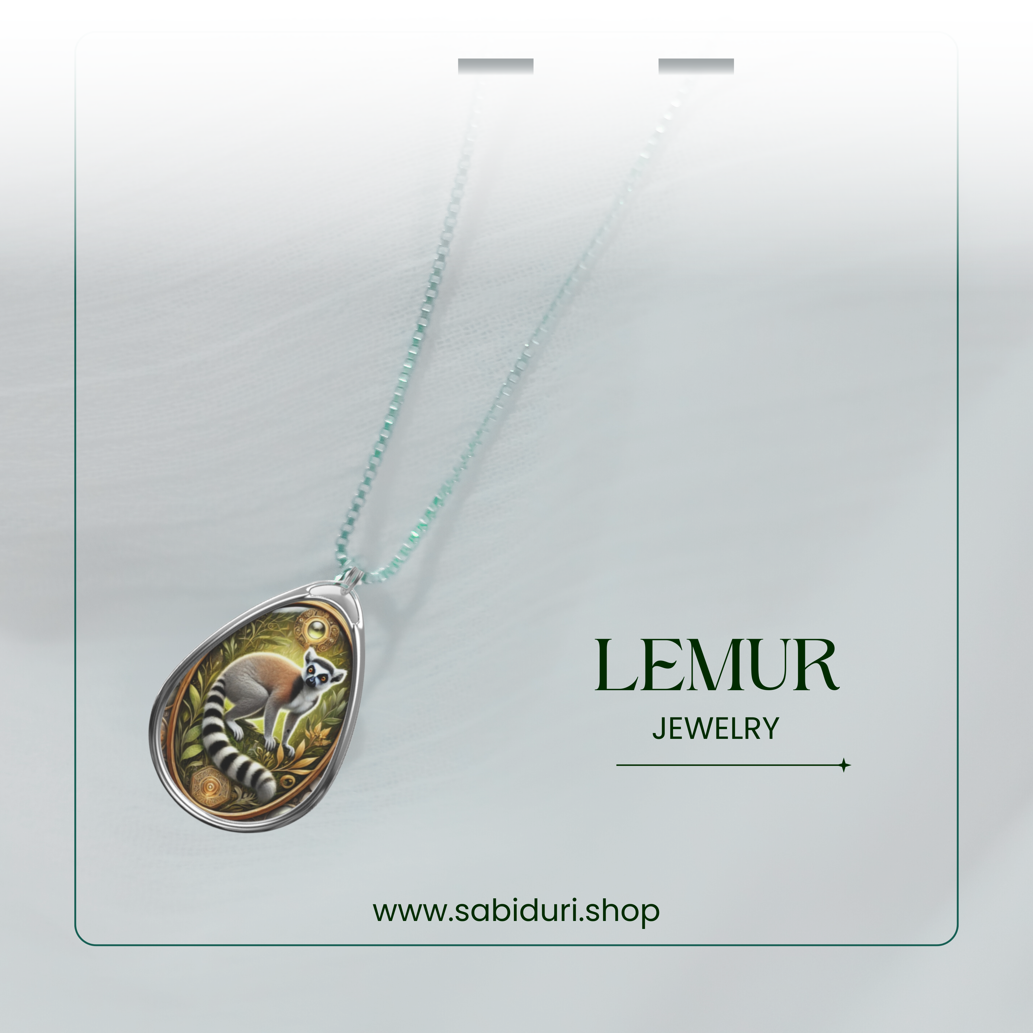 A close-up shot of a beautifully crafted lemur pendant on a gradient white background, emphasizing the pendant's earthy tones and intricate metalwork. The text "LEMUR JEWELRY" and "www.sabiduri.shop" is subtly integrated into the design.