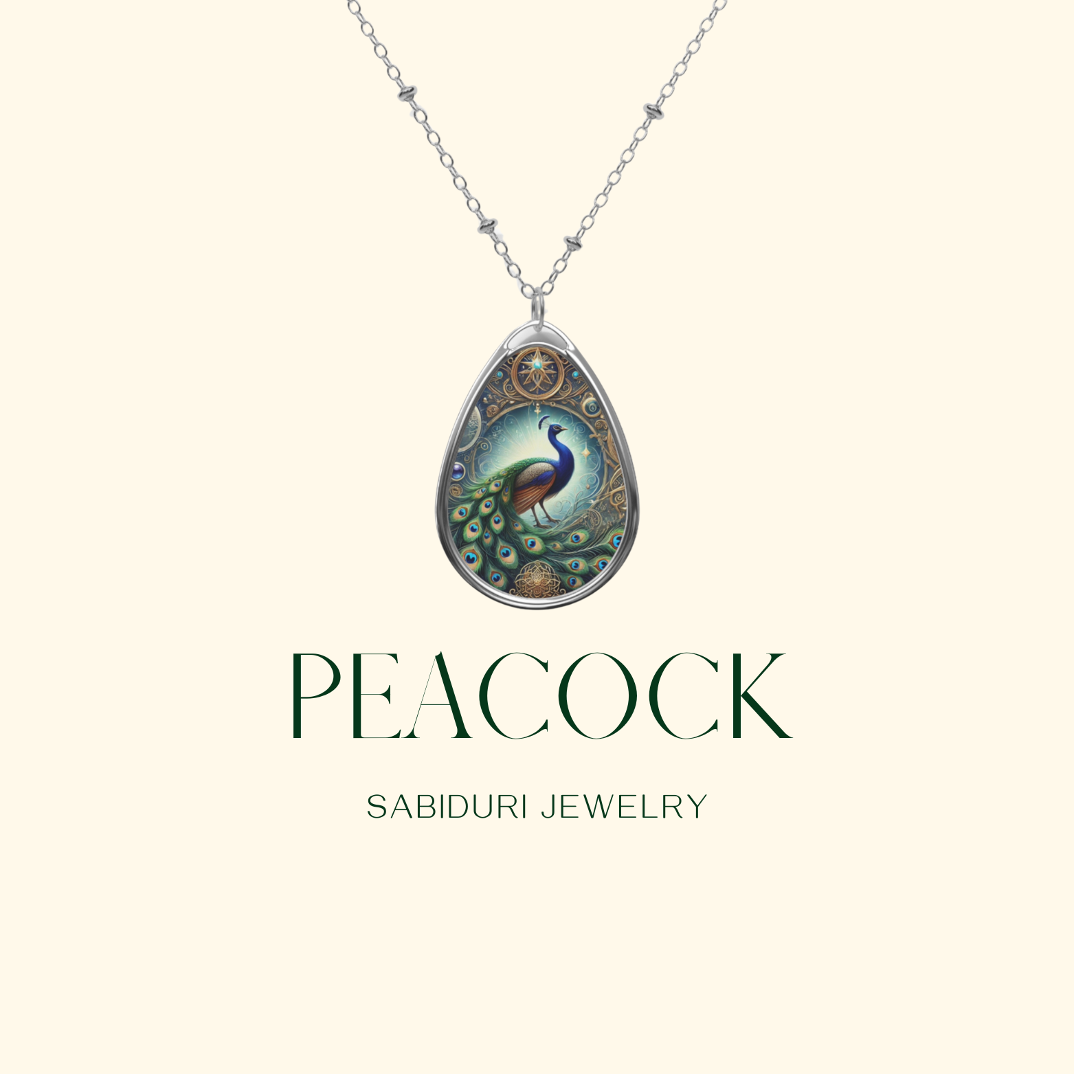 A close-up of a teardrop-shaped peacock necklace, suspended from a silver chain against a minimalist beige background. The pendant features an intricately designed peacock with luminous blue and green hues, set within a gold-ornate border. "Peacock" and "Sabiduri Jewelry" are elegantly written below.