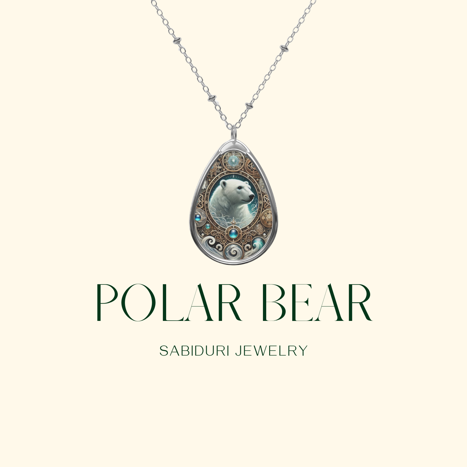 A teardrop-shaped pendant featuring an intricately designed polar bear surrounded by icy blue and gold filigree patterns. The pendant hangs from a delicate silver chain against a neutral background, with "Polar Bear" and "Sabiduri Jewelry" displayed below.