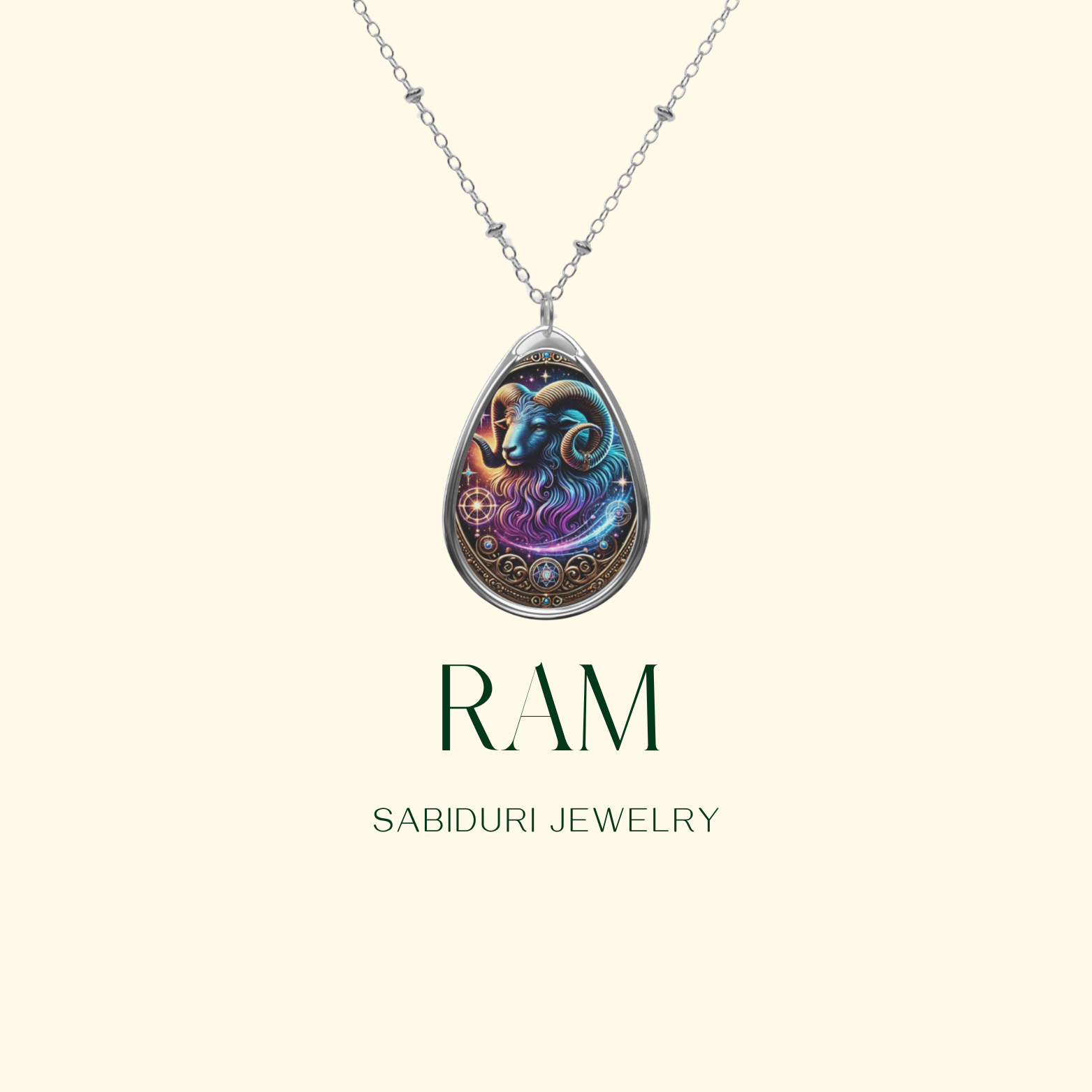 A detailed ram-themed pendant necklace with intricate gold and celestial elements, suspended from a silver chain. The design features a mystical, cosmic-inspired illustration of a ram in blue and purple tones. The text 'RAM' and 'SABIDURI JEWELRY' are displayed beneath the pendant on a minimalist cream-colored background.