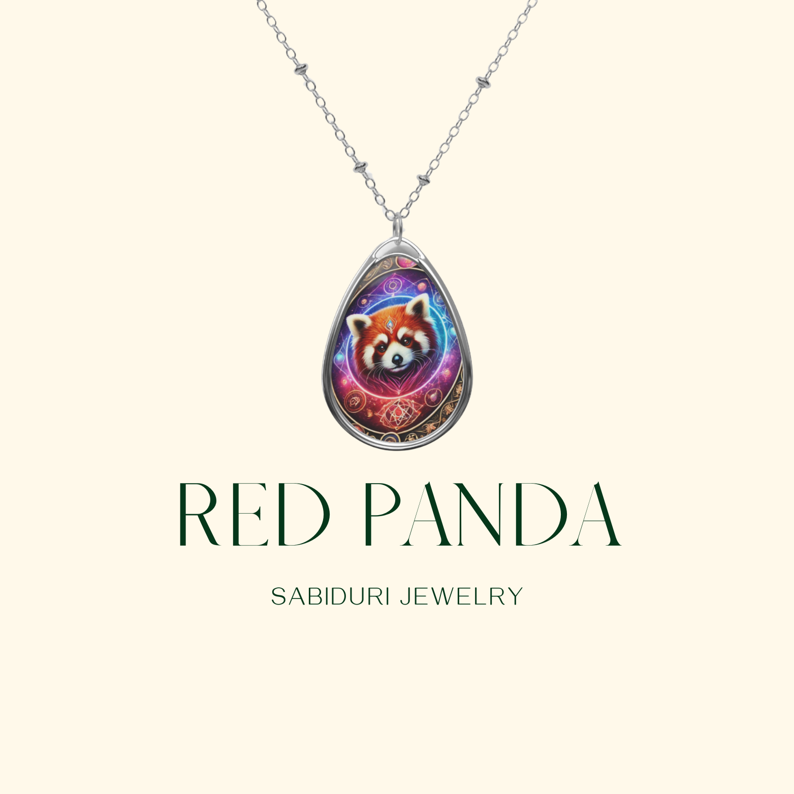 A close-up of a silver teardrop pendant necklace showcasing a vibrant red panda illustration with celestial elements. The text "RED PANDA" and "SABIDURI JEWELRY" is elegantly displayed on a soft cream-colored background.