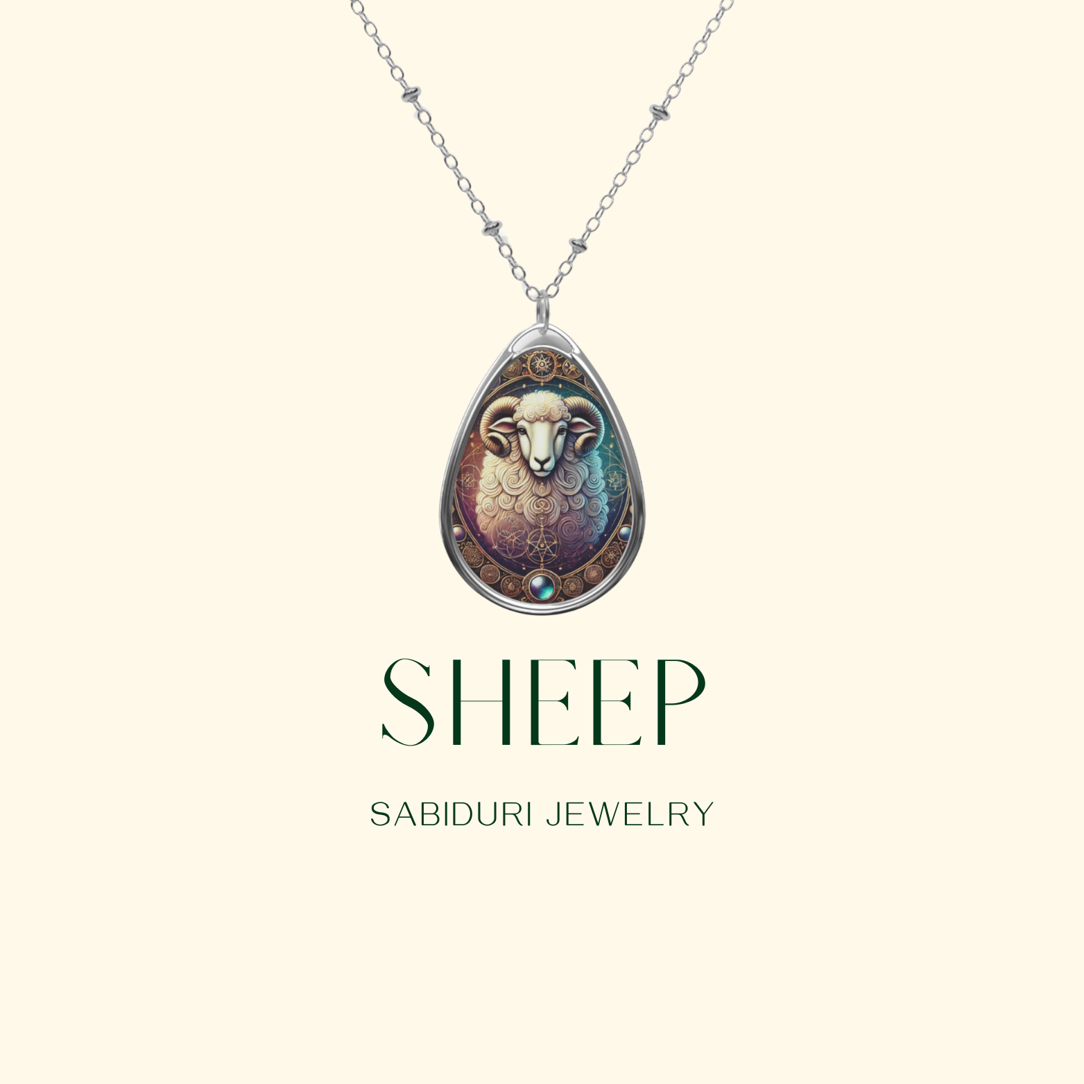 A silver necklace with a teardrop-shaped pendant showcasing an artistic sheep illustration. The background is soft beige with the text "SHEEP – SABIDURI JEWELRY" beneath it.