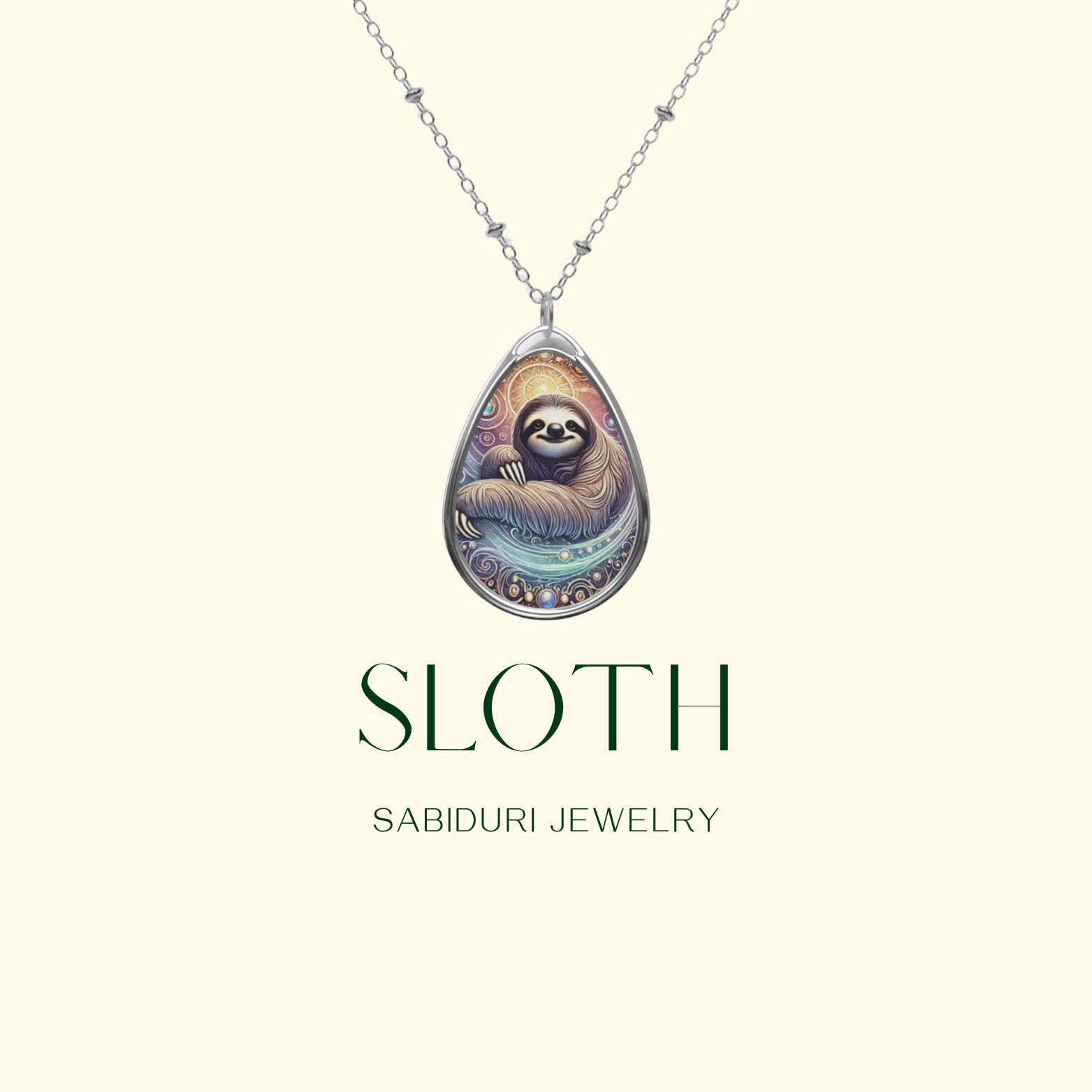 A digital image of a silver necklace with a teardrop-shaped pendant showcasing an ornate sloth design. The pendant has warm, intricate detailing and a cosmic aesthetic. The text "SLOTH" and "SABIDURI JEWELRY" appears in elegant typography.