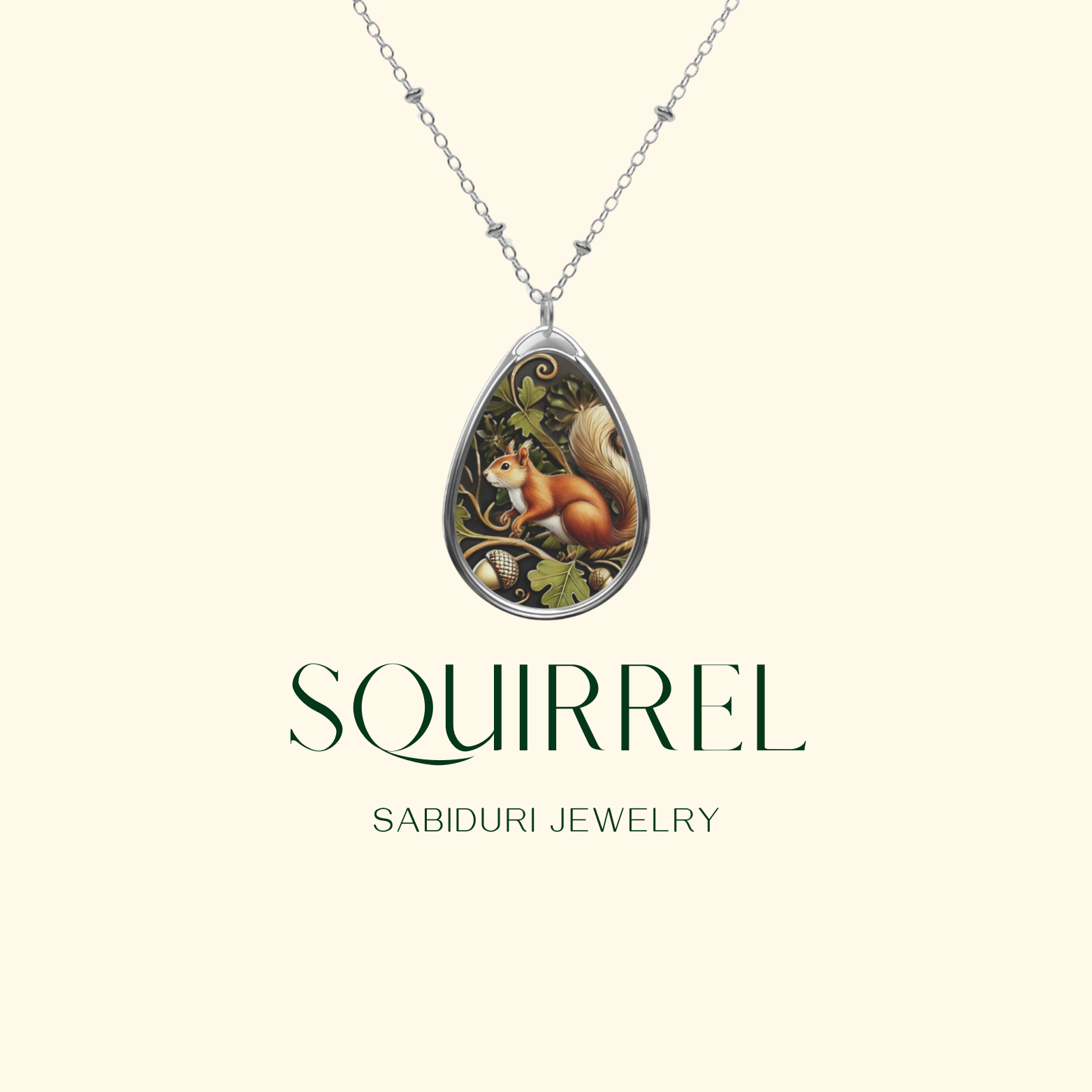 A teardrop-shaped pendant necklace featuring a detailed illustration of a squirrel surrounded by acorns and oak leaves. Below the pendant, the word 'SQUIRREL' is prominently displayed in elegant green typography, with 'SABIDURI JEWELRY' written underneath.