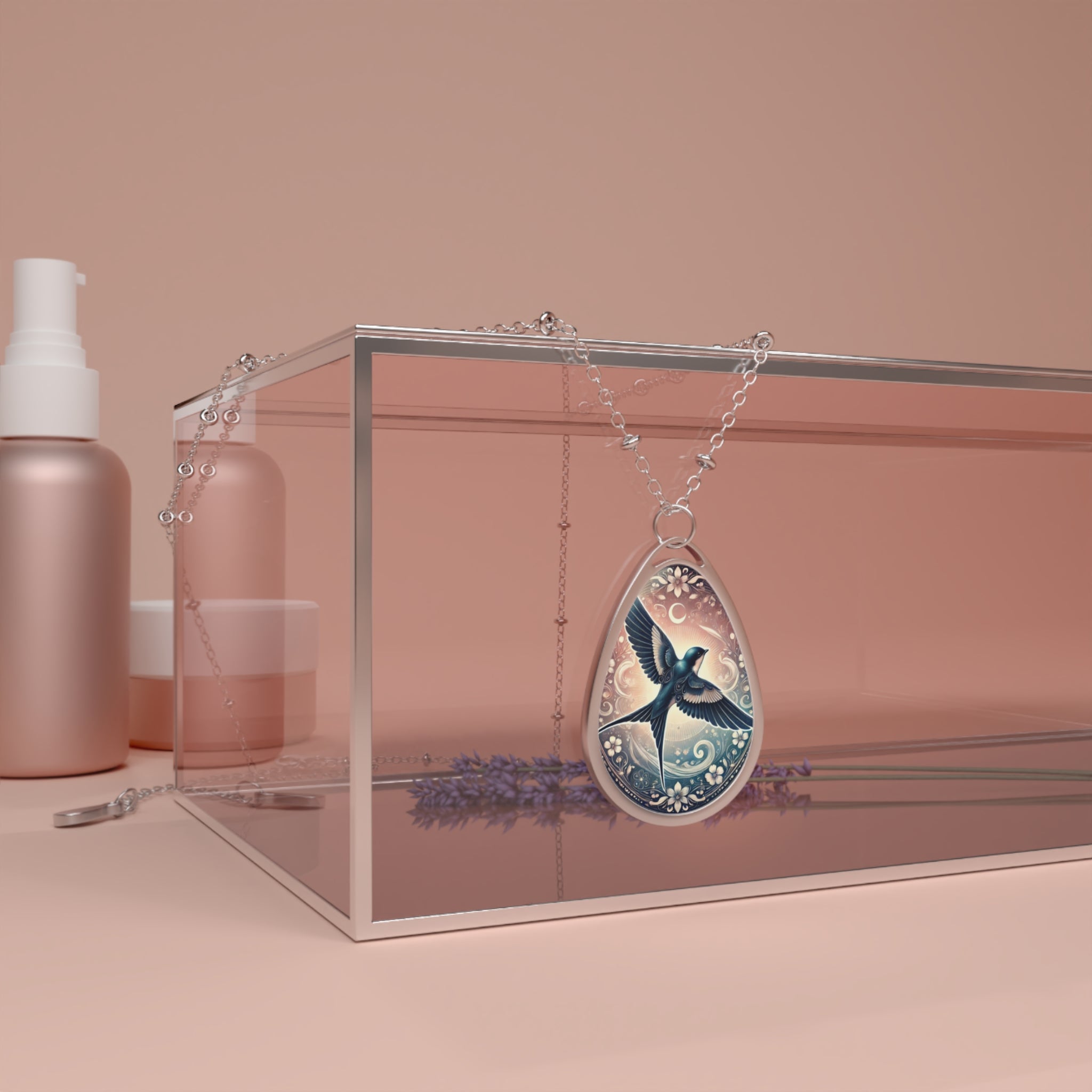 The swallow pendant necklace draped over a transparent jewelry display box on a pastel-toned surface. The pendant’s design features a vibrant blue swallow in mid-flight, encircled by celestial and floral embellishments. Soft lighting enhances the intricate details of the pendant.