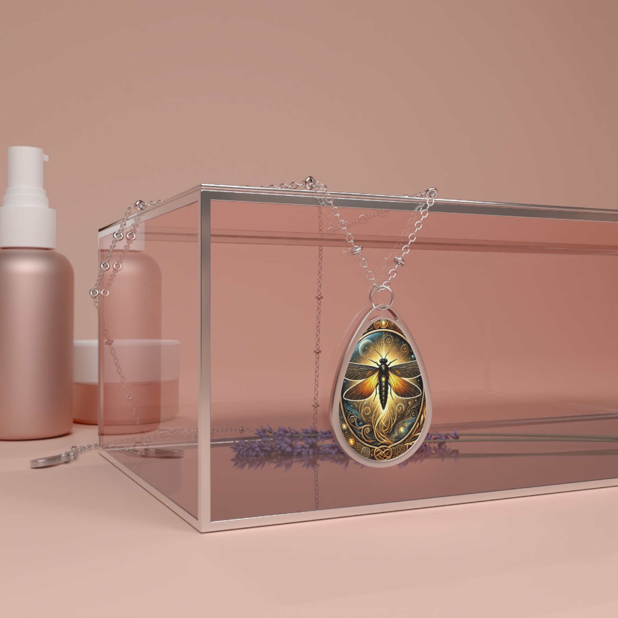 A lifestyle shot of the firefly pendant necklace draped over a transparent acrylic box with lavender sprigs beneath. The pendant’s celestial glow and detailed filigree work are showcased in a warm-toned setting.