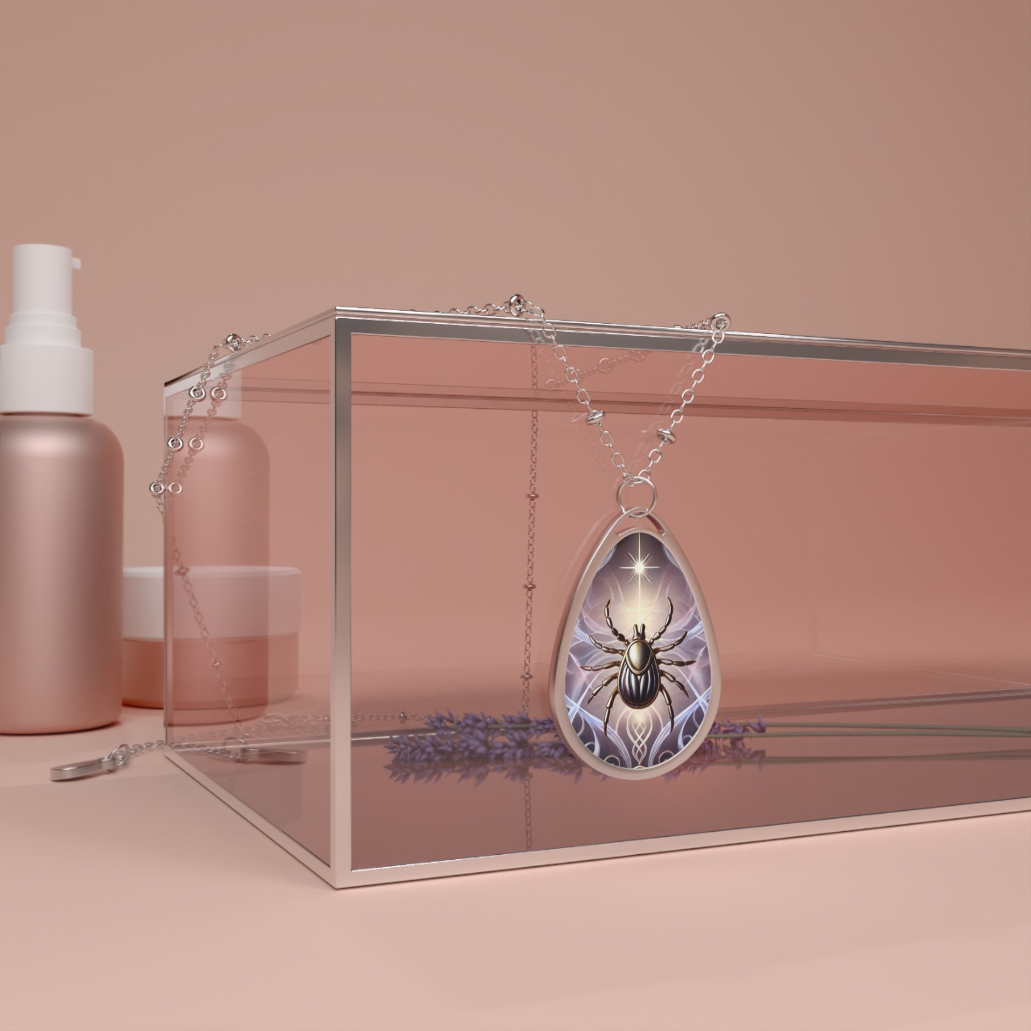 A teardrop-shaped pendant featuring an intricate illustration of a tick with a glowing star above it, resting on a reflective glass box surrounded by minimalistic, blush-toned cosmetic bottles.