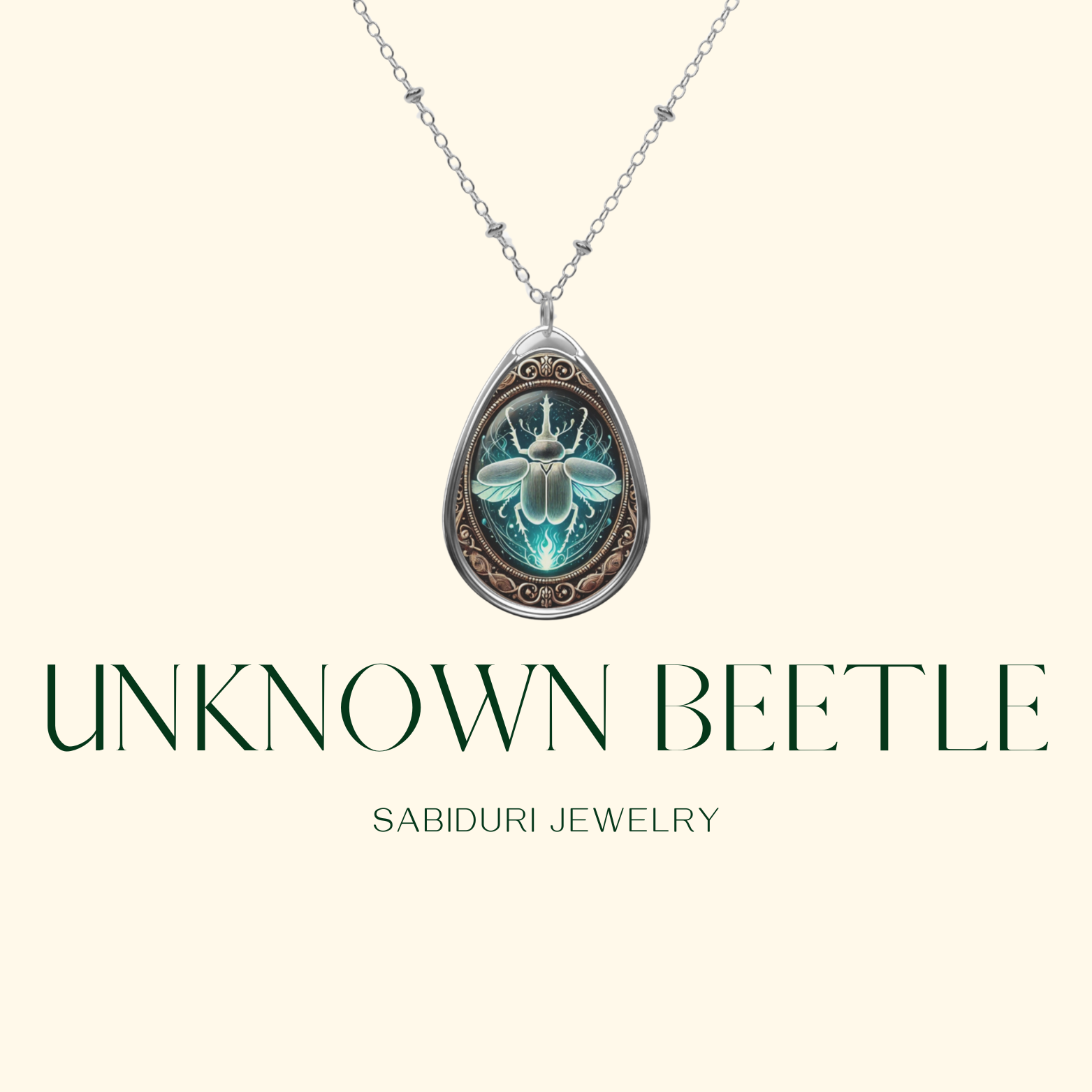 A silver chain necklace with a teardrop-shaped pendant showcasing a detailed unknown beetle illustration in a celestial setting. The image has a minimalist, cream-colored background with "UNKNOWN BEETLE" and "SABIDURI JEWELRY" in a refined, modern font.