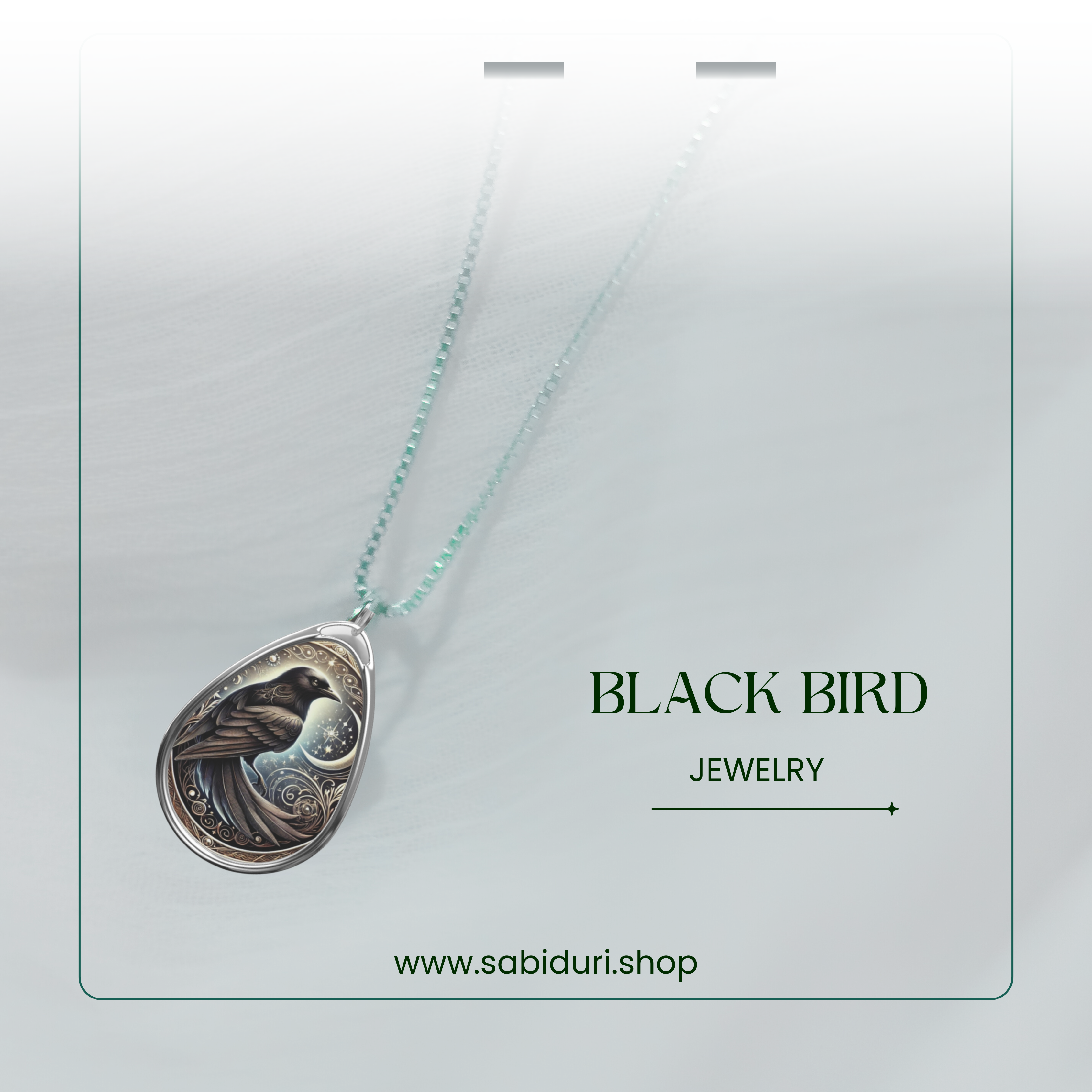 A close-up of the Black Bird Spirit Animal Necklace, highlighting the detailed engraving of a black bird against a starry night sky. The pendant is attached to a fine chain, with the words "Black Bird Jewelry" and the website "www.sabiduri.shop" displayed on the image.