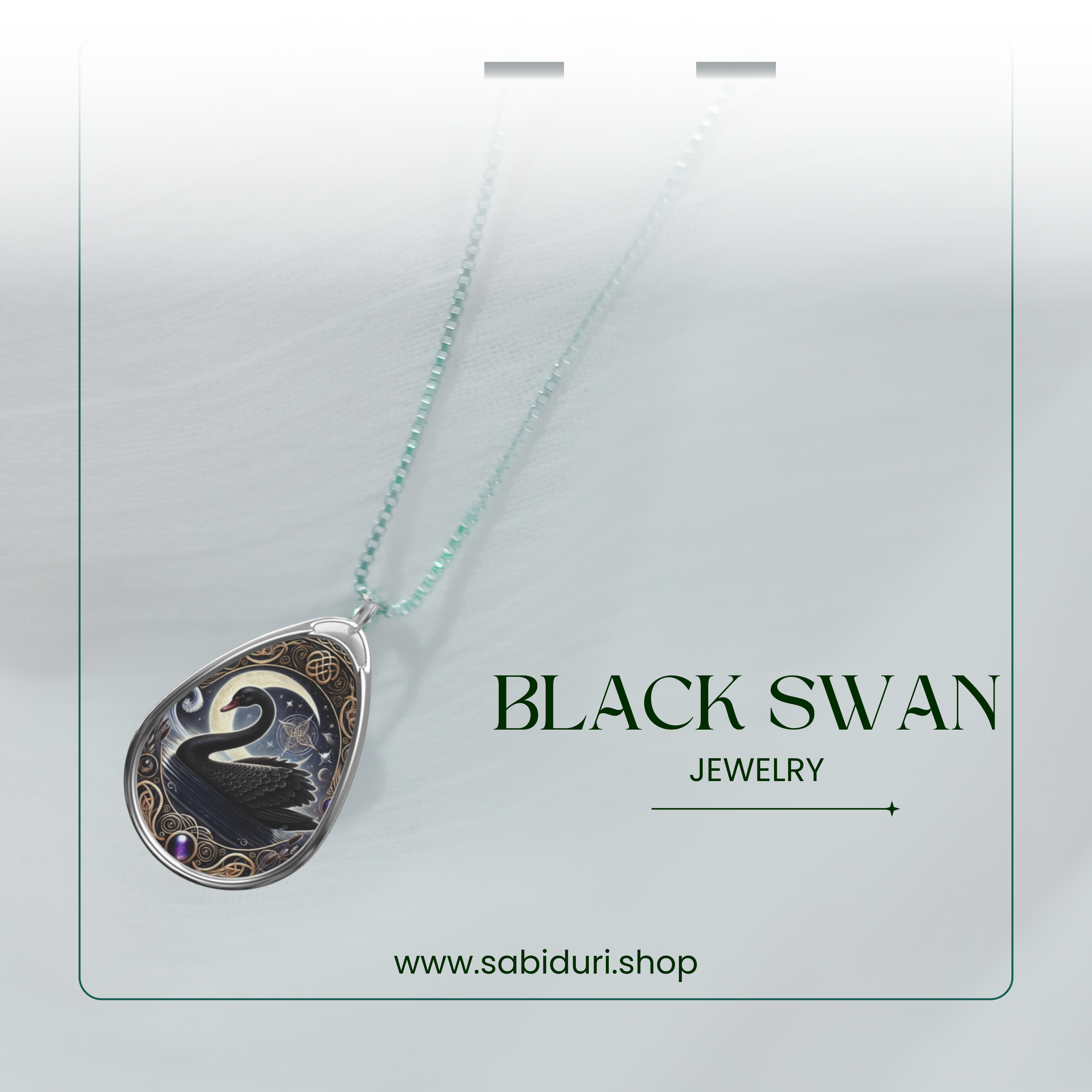 A close-up of the Black Swan pendant against a soft, white gradient background. The pendant features a black swan, crescent moon, and celestial details surrounded by golden accents and a small purple gemstone. The chain transitions into a soft teal hue, complementing the pendant’s elegant design. The words "BLACK SWAN" and "JEWELRY" are positioned to the right, with "www.sabiduri.shop" at the bottom.