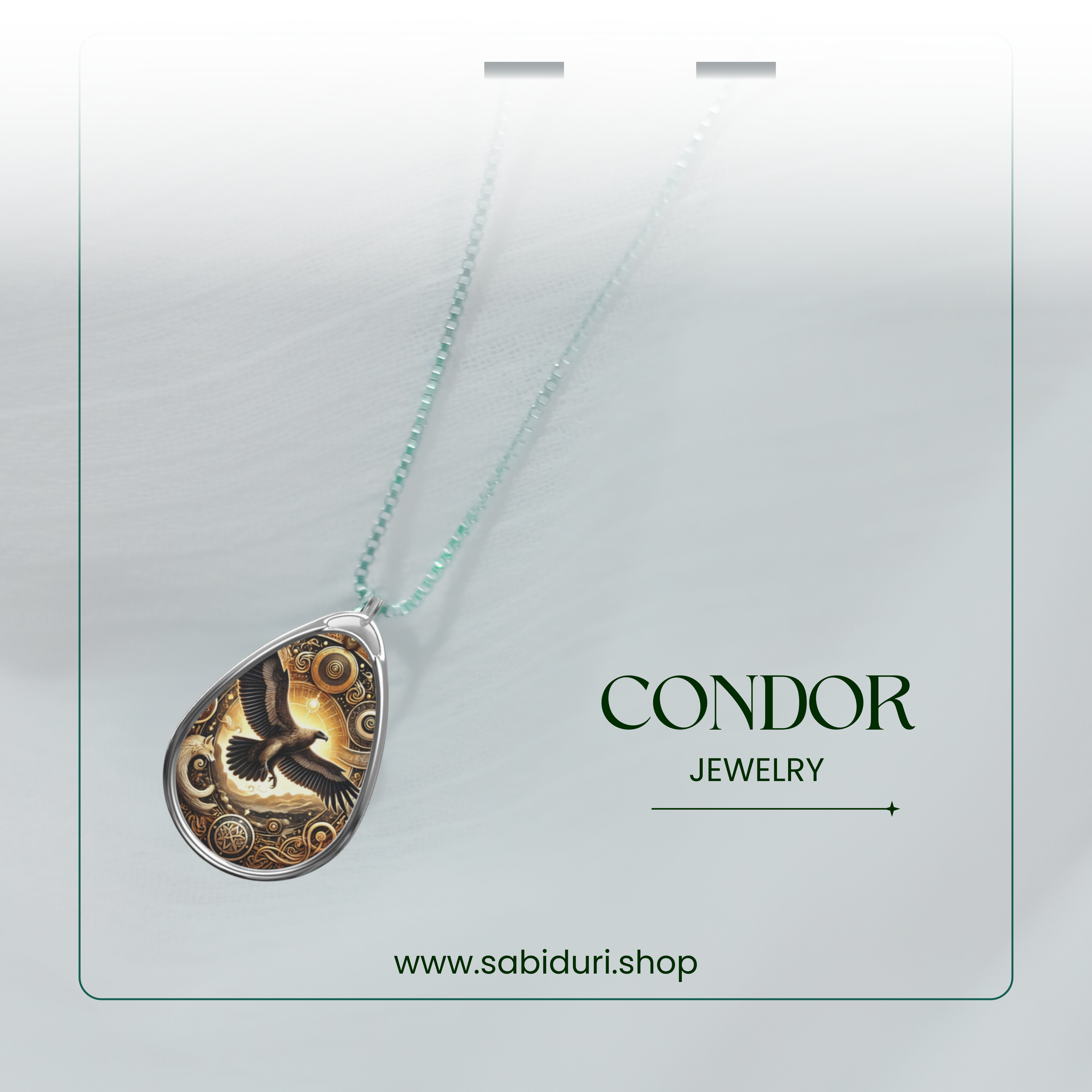 A stylish product showcase of the cormorant necklace against a semi-transparent white backdrop. The pendant, featuring a black cormorant with gold and blue accents, hangs from a delicate silver chain. The text "CORMORANT JEWELRY" and "www.sabiduri.shop" is positioned to highlight the brand.