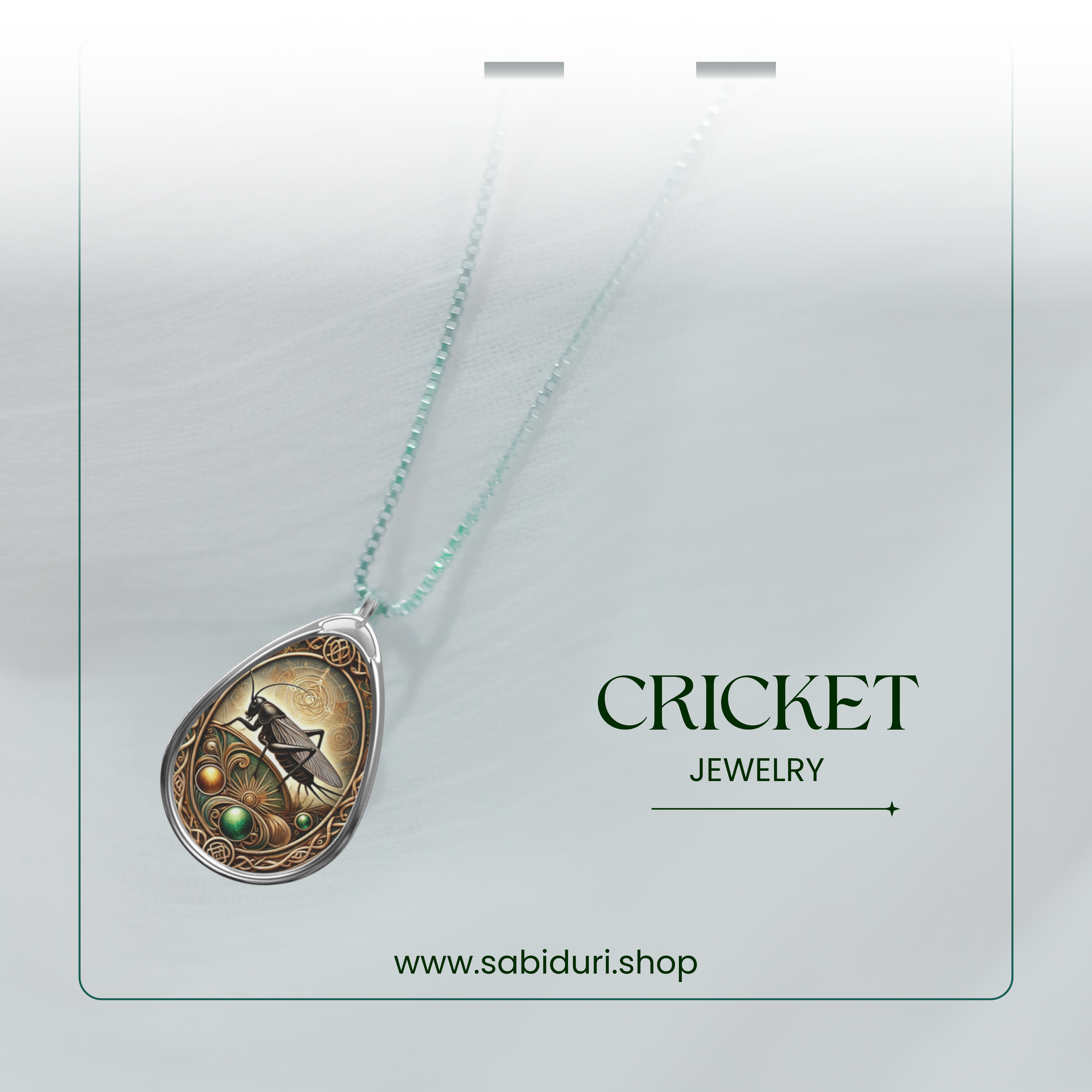 A stylish presentation of a cricket pendant necklace, elegantly hanging from a delicate chain against a white, soft-focus background. The text "CRICKET JEWELRY" and "www.sabiduri.shop" is displayed, giving it a refined and modern branding touch.