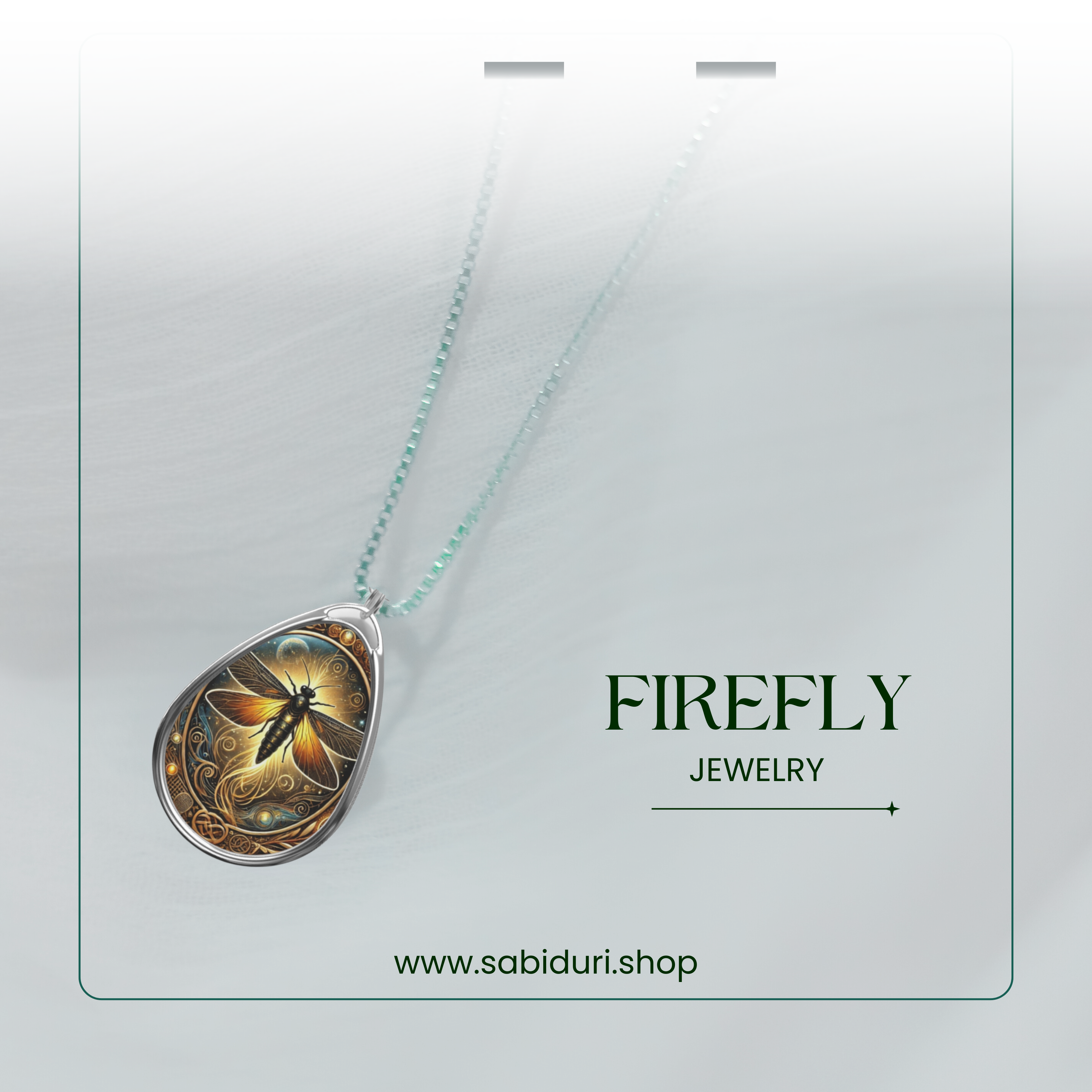 A close-up of the firefly necklace on a soft, white gradient background, highlighting the shimmering details of the pendant. The design features a firefly with outstretched wings surrounded by intricate golden patterns. The text "FIREFLY JEWELRY" and the website "www.sabiduri.shop" frame the image.