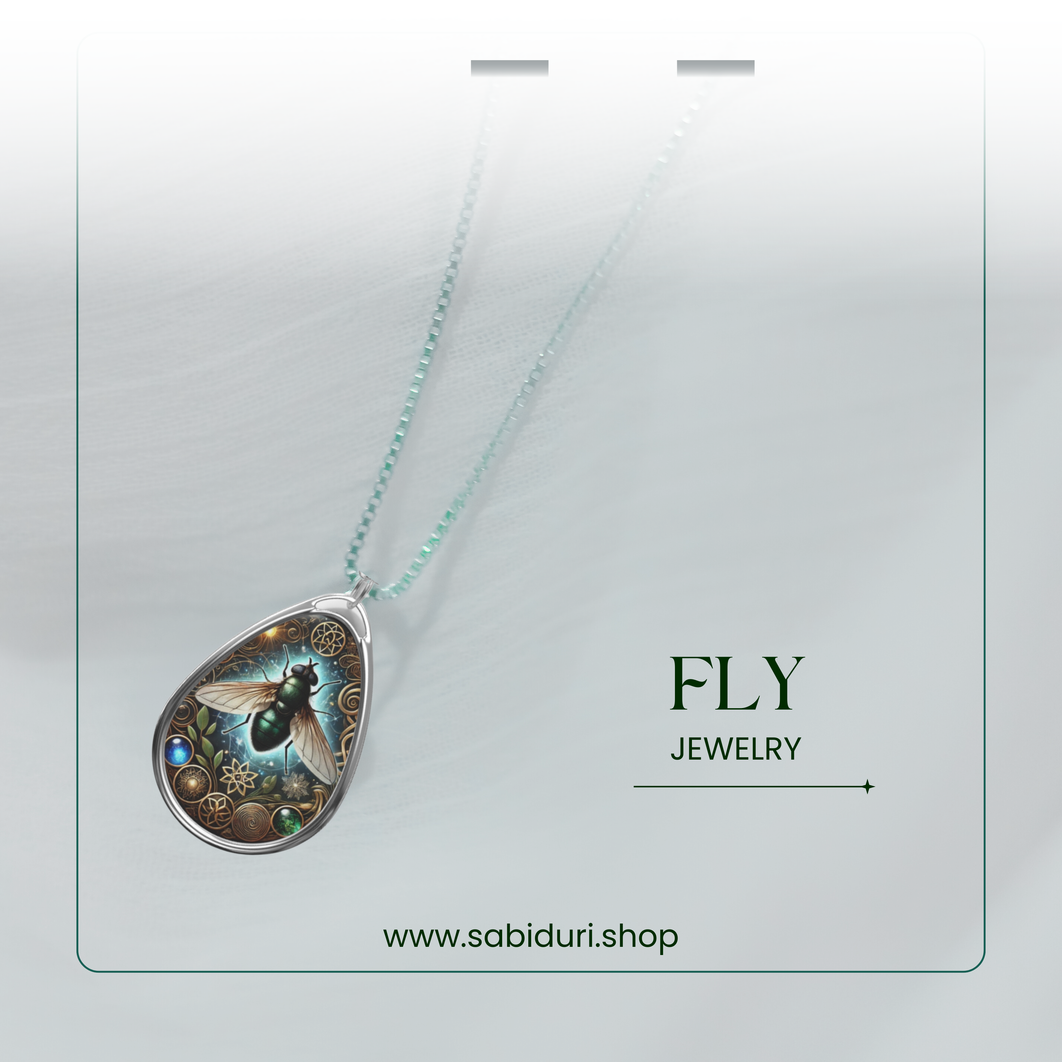 The Fly Spirit Animal necklace hanging on a thin silver chain, set against a soft, blurred white backdrop. The pendant’s glowing blue hues and intricate metallic patterns stand out, with "FLY JEWELRY" and "www.sabiduri.shop" placed neatly in the lower part of the image.