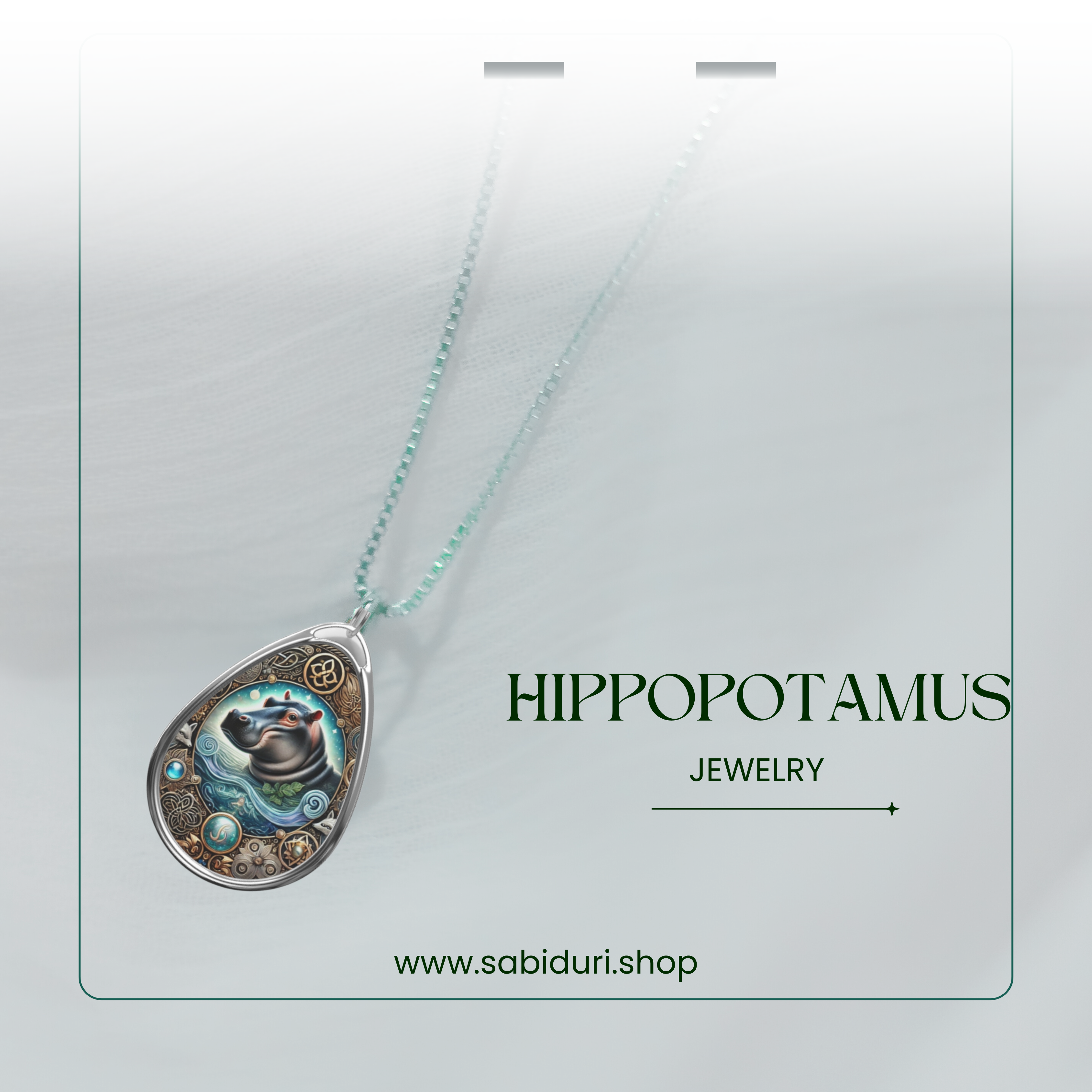 The Hippopotamus Spirit Animal pendant is displayed on a delicate silver chain, softly draped. The pendant’s design highlights the hippo amidst swirling water patterns, with "Hippopotamus Jewelry" written in an elegant serif font and the brand’s website at the bottom.