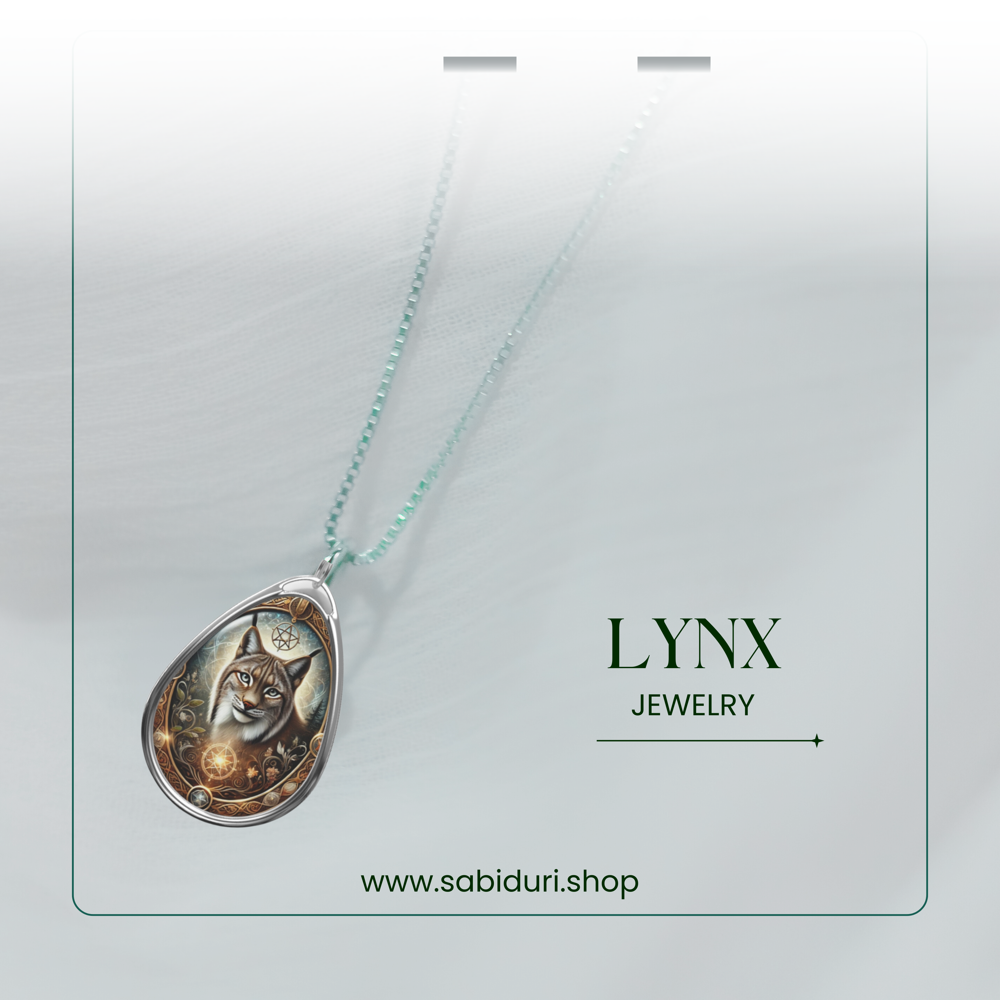 A close-up of the Lynx pendant, suspended from a delicate beaded chain, floating in an elegant, soft white background. The golden and silver tones of the pendant contrast beautifully with the lynx’s realistic expression. The text "LYNX JEWELRY" and "www.sabiduri.shop" is included.